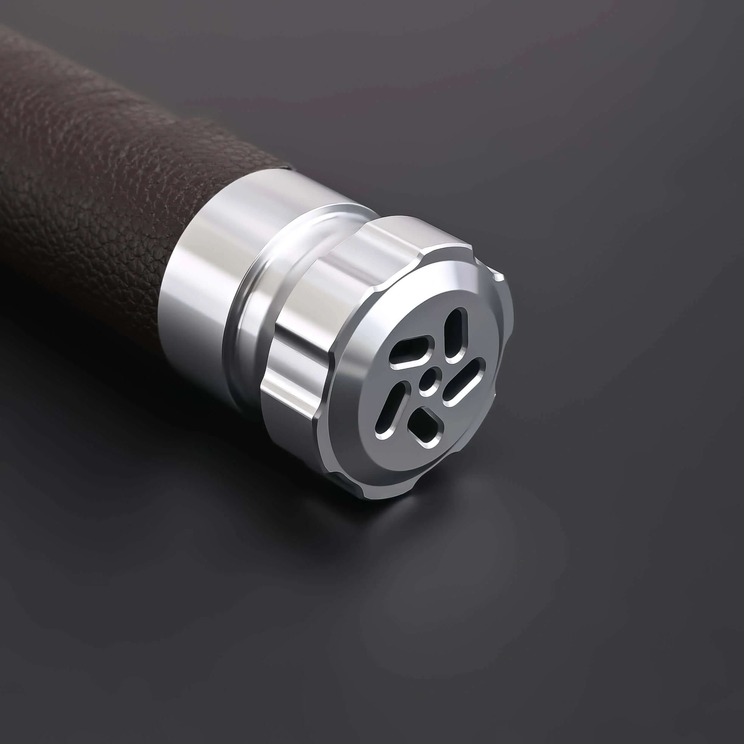 Close-up of the hilt of the Crusades Lightsaber featuring a sleek metallic design and textured grip.