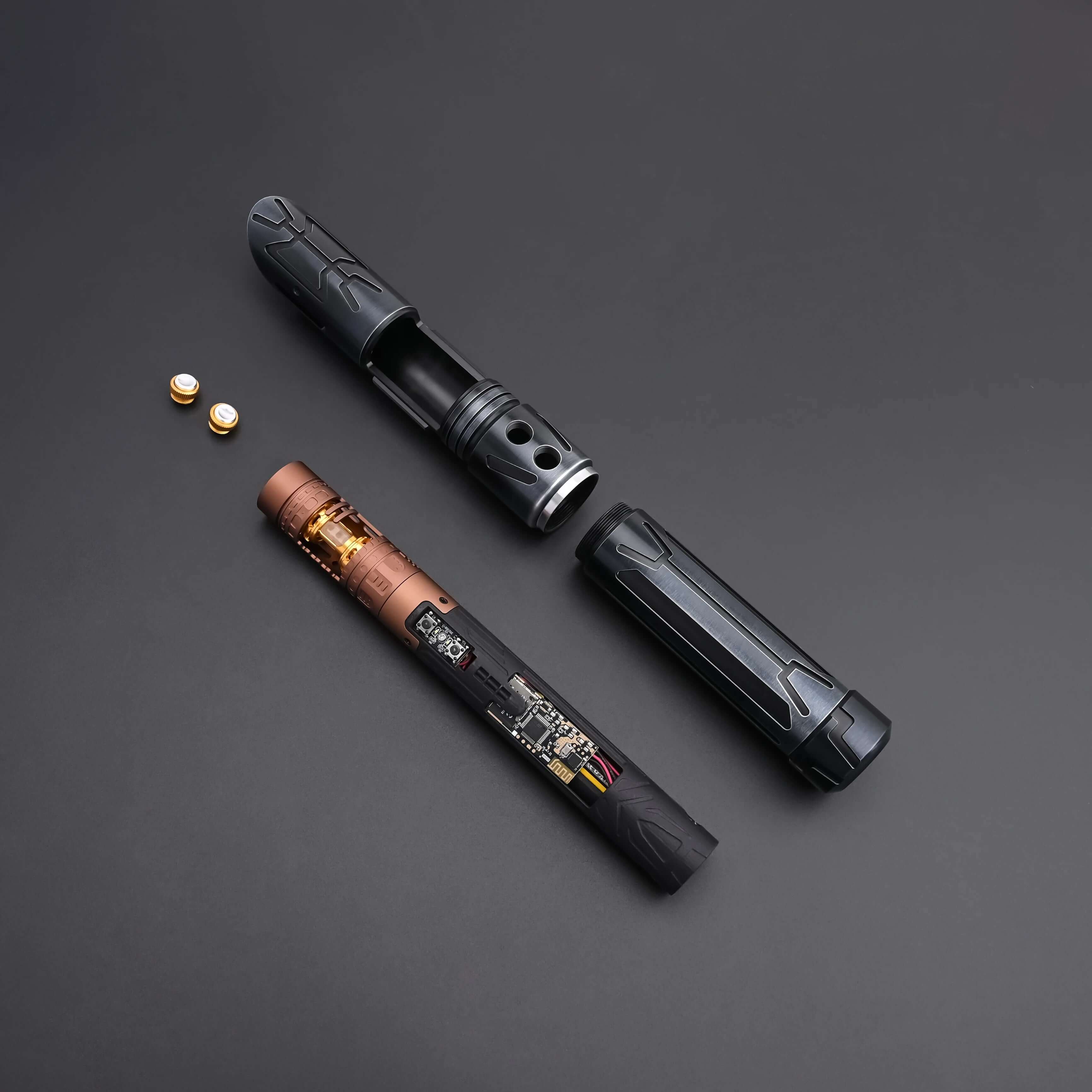 Halo crystal lightsaber parts with exposed crystal core and detailed design on a dark background.