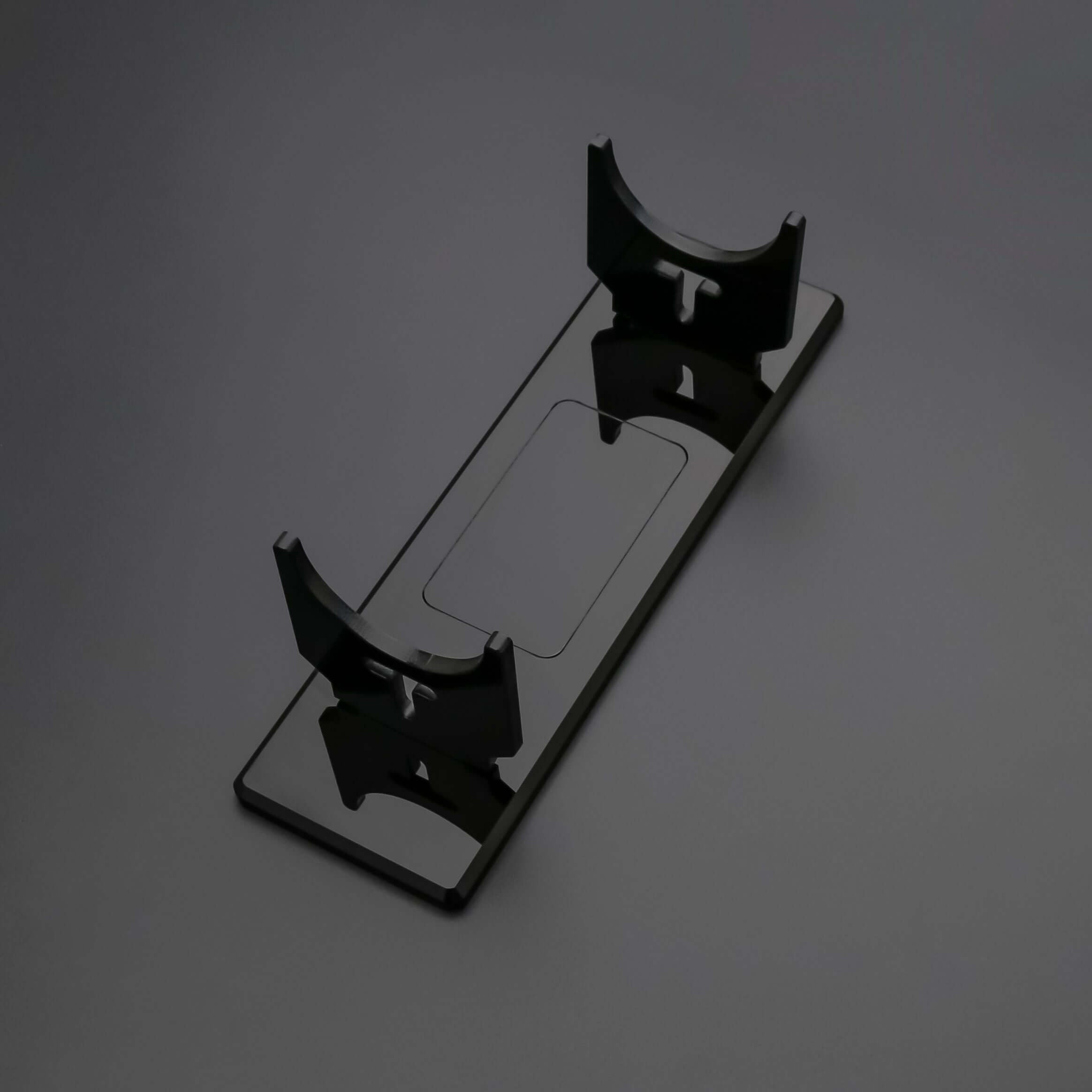 Clear acrylic display stand designed for stability, perfect for showcasing collectible sabers.
