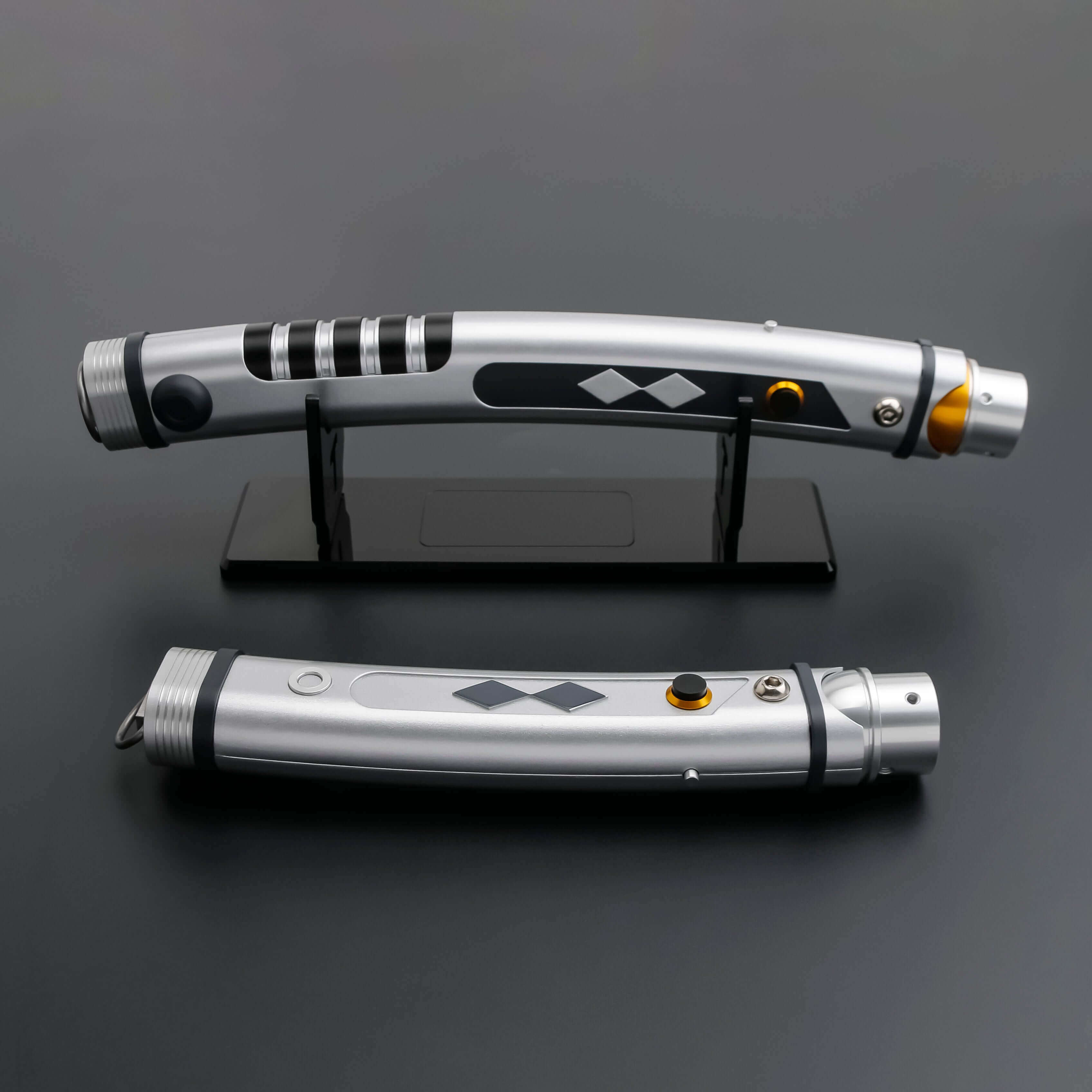 Tano lightsaber with silver and black anodized aluminum hilt, featuring 12 blade colors, 27 sound fonts, and options for Baselit, S-RGB, Neopixel, or Proffie cores, ideal for cosplay and light dueling.