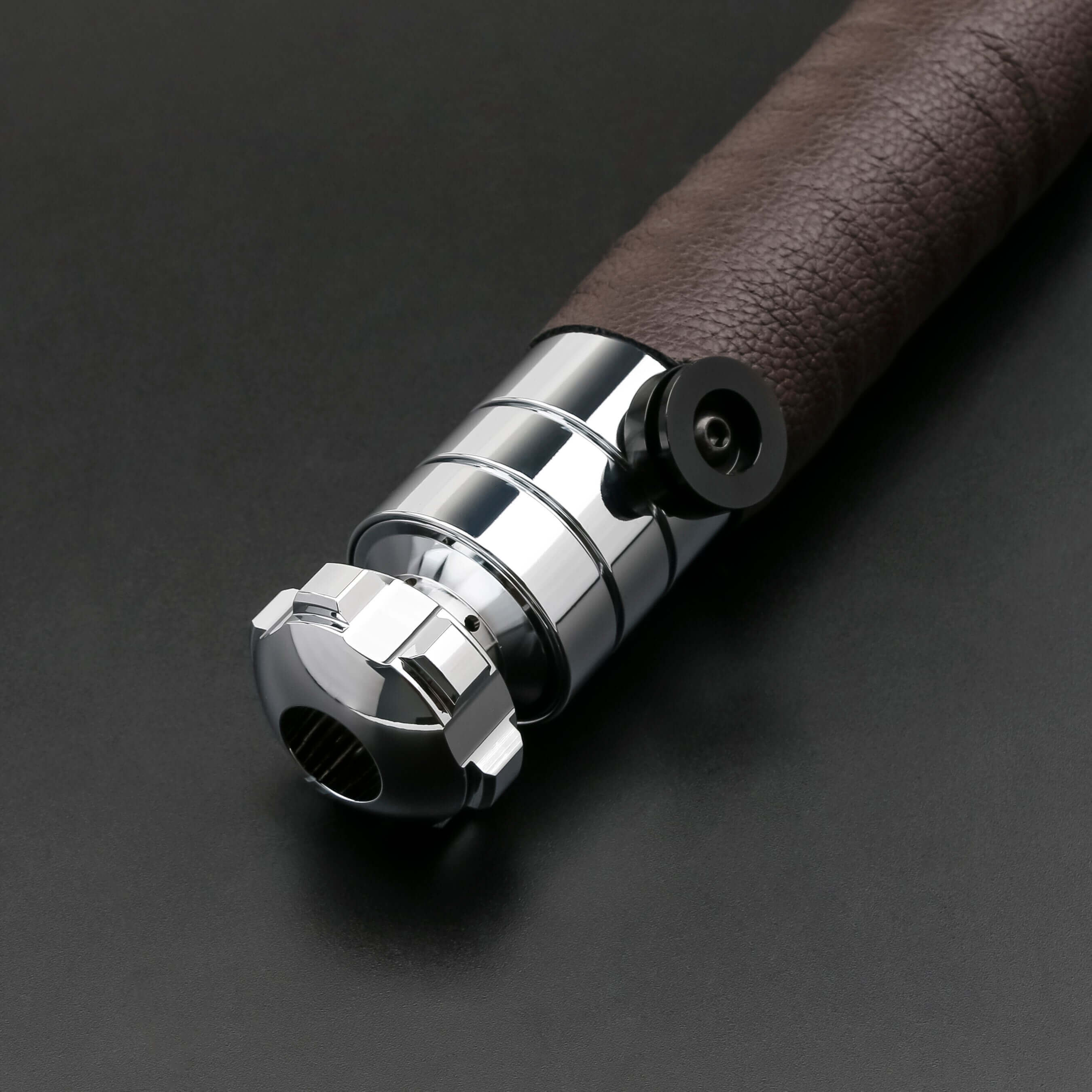 Revan lightsaber with silver and black anodized aluminum hilt, featuring 12 blade colors, 16 sound fonts, and options for Baselit, S-RGB, Neopixel, or Proffie cores, ideal for cosplay and light dueling