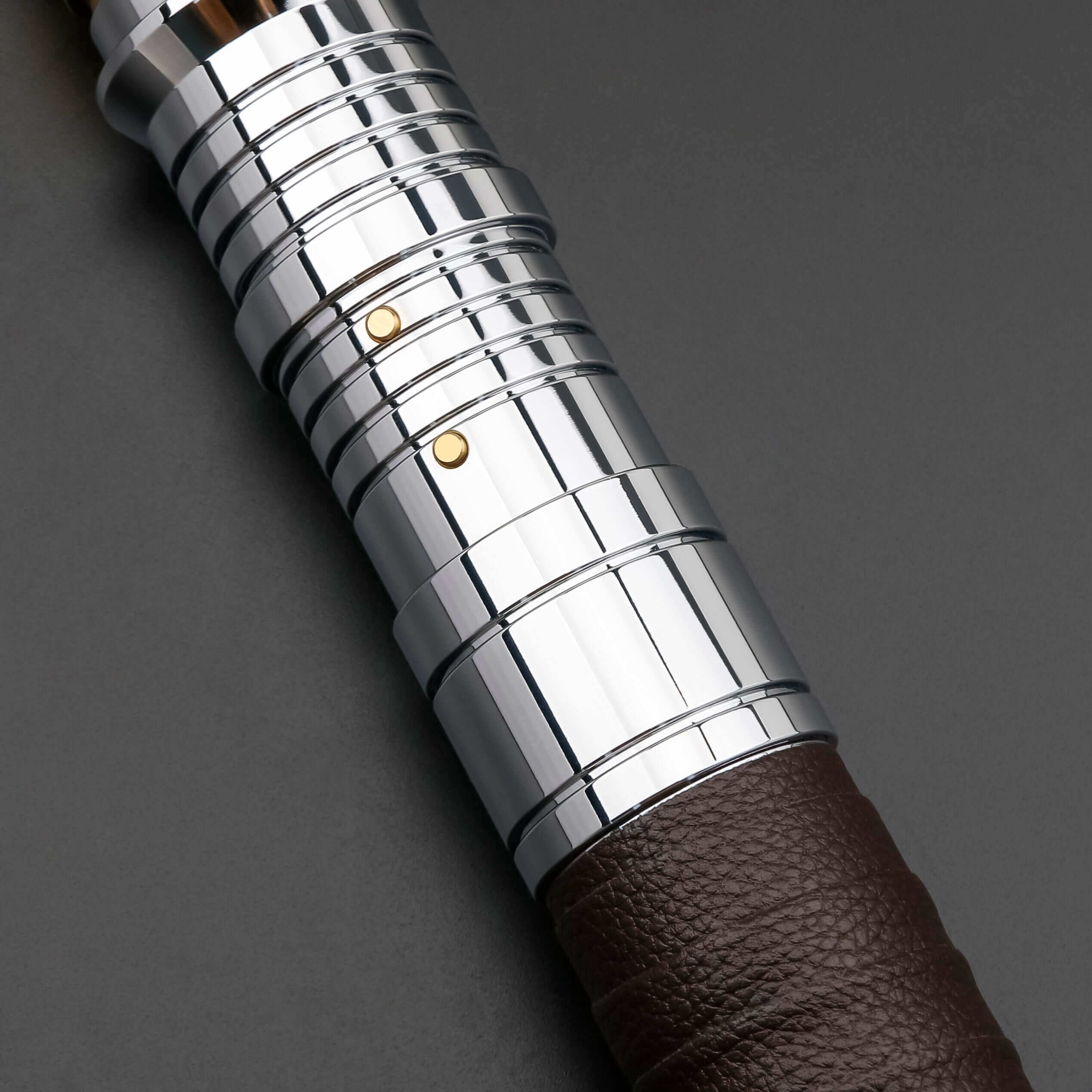 Revan lightsaber with silver and black anodized aluminum hilt, featuring 12 blade colors, 16 sound fonts, and options for Baselit, S-RGB, Neopixel, or Proffie cores, ideal for cosplay and light dueling