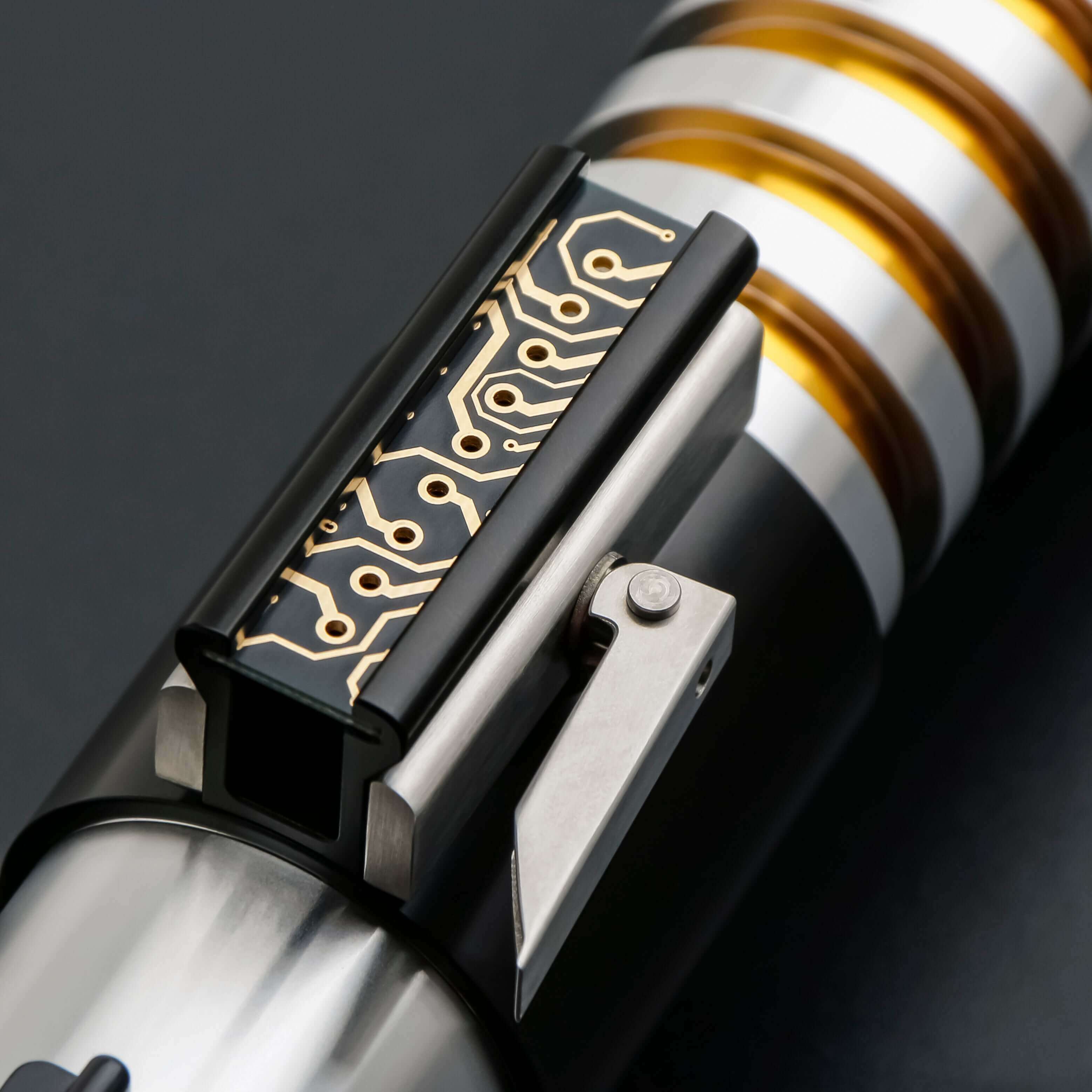 Elzar Mann lightsaber with black anodized aluminum hilt, polished silver accents, 32" polycarbonate blade, 27 sound fonts, 12 blade colors, and Neopixel or Proffie core options for dynamic effects and dueling.