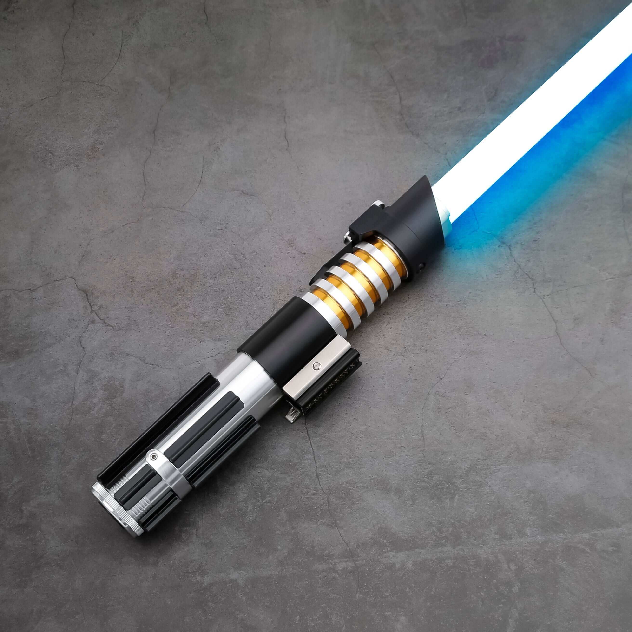 Elzar Mann lightsaber with black anodized aluminum hilt, polished silver accents, 32" polycarbonate blade, 27 sound fonts, 12 blade colors, and Neopixel or Proffie core options for dynamic effects and dueling.