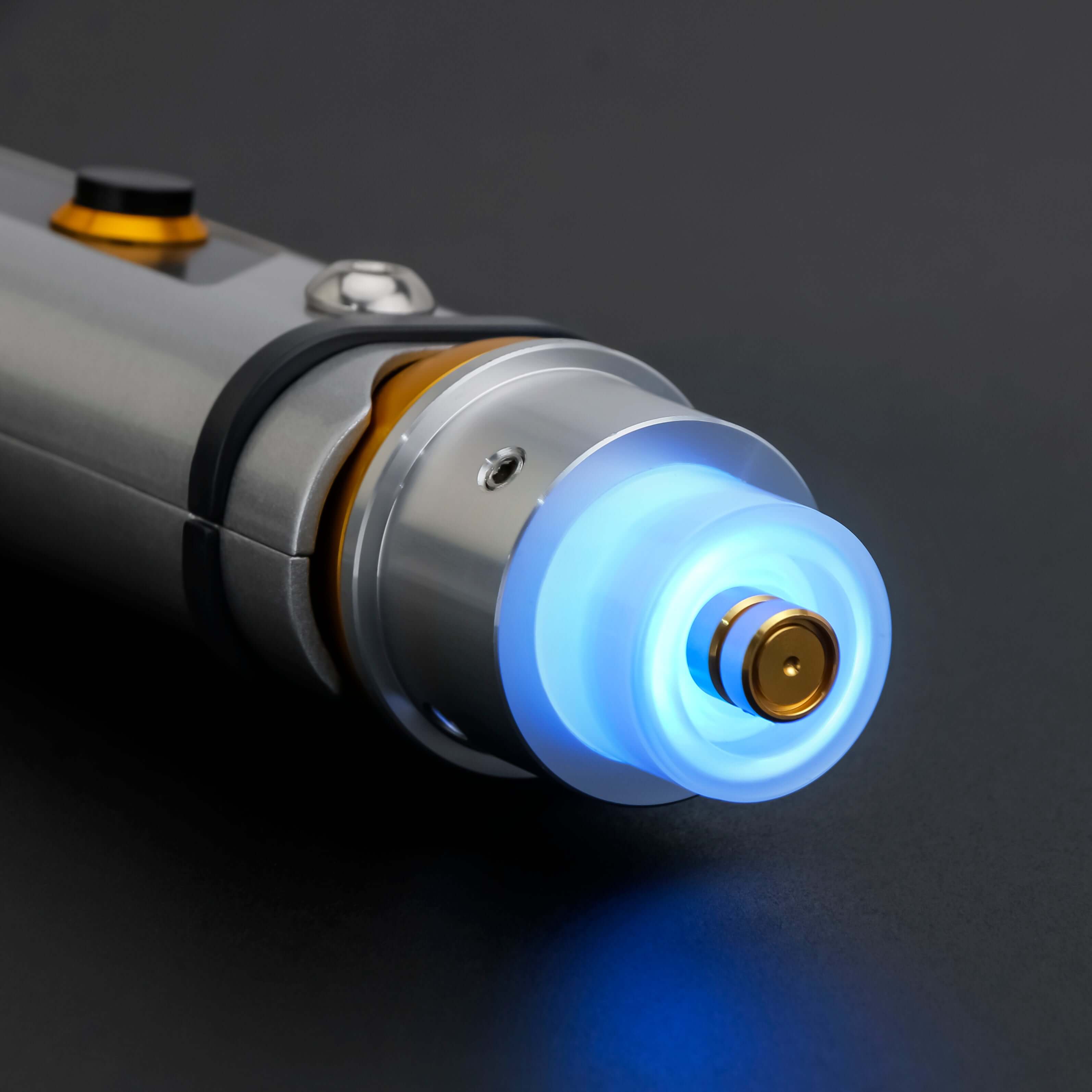 Tano lightsaber with silver and black anodized aluminum hilt, featuring 12 blade colors, 27 sound fonts, and options for Baselit, S-RGB, Neopixel, or Proffie cores, ideal for cosplay and light dueling.