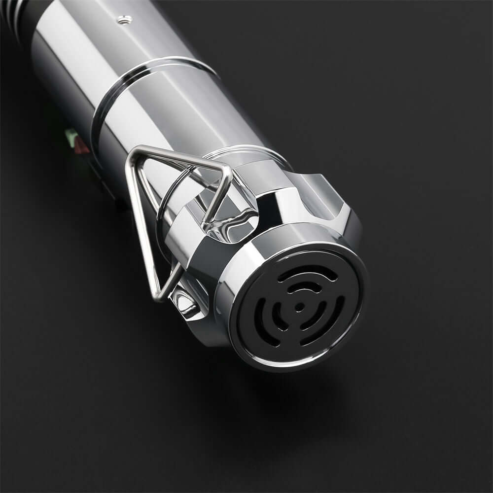 Close-up view of the grip and emitter of Luke EP6 lightsaber replica with circular patterns and shiny finish.