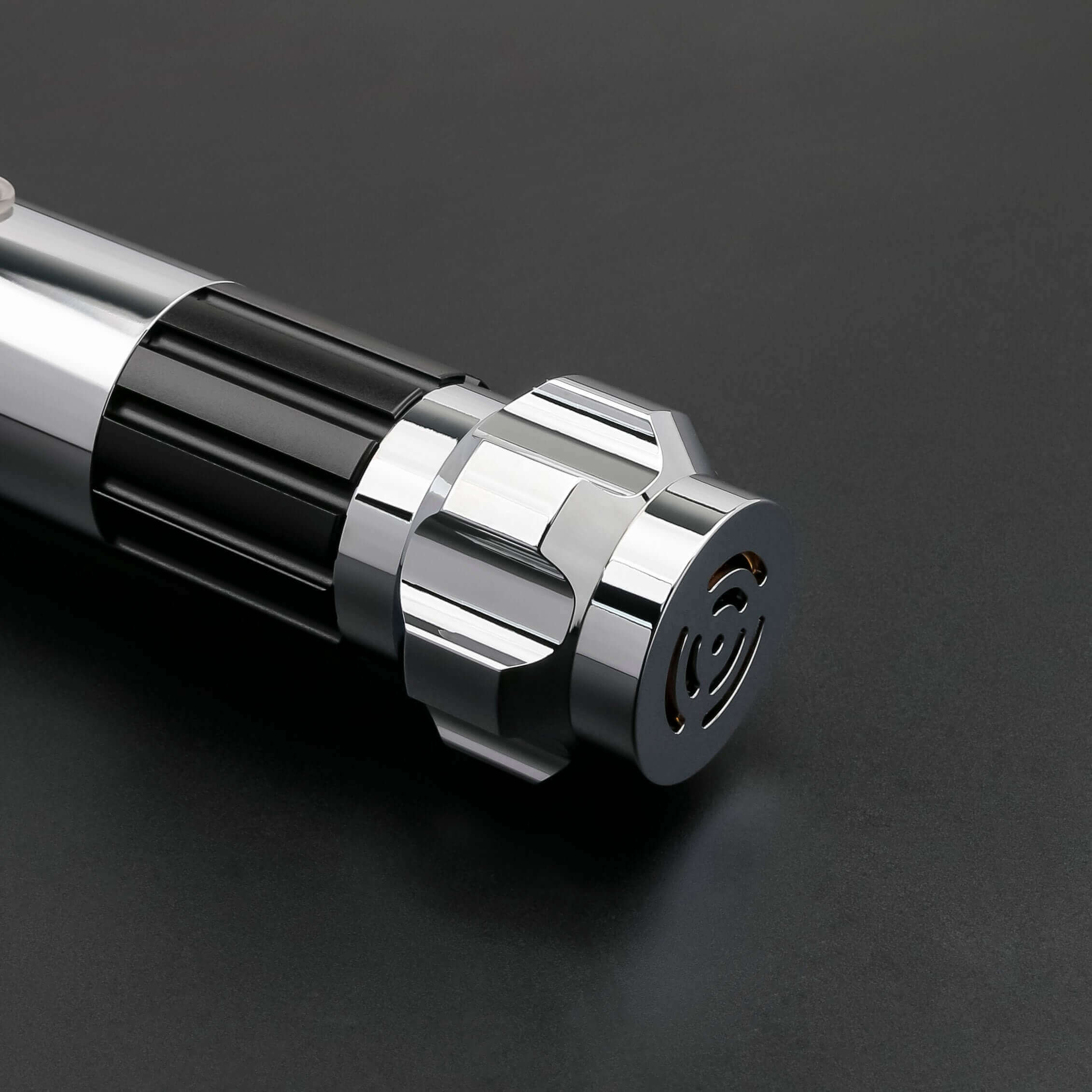 Close-up of the Obi-Wan Kenobi Neopixel Lightsaber, showcasing its sleek chrome hilt details.
