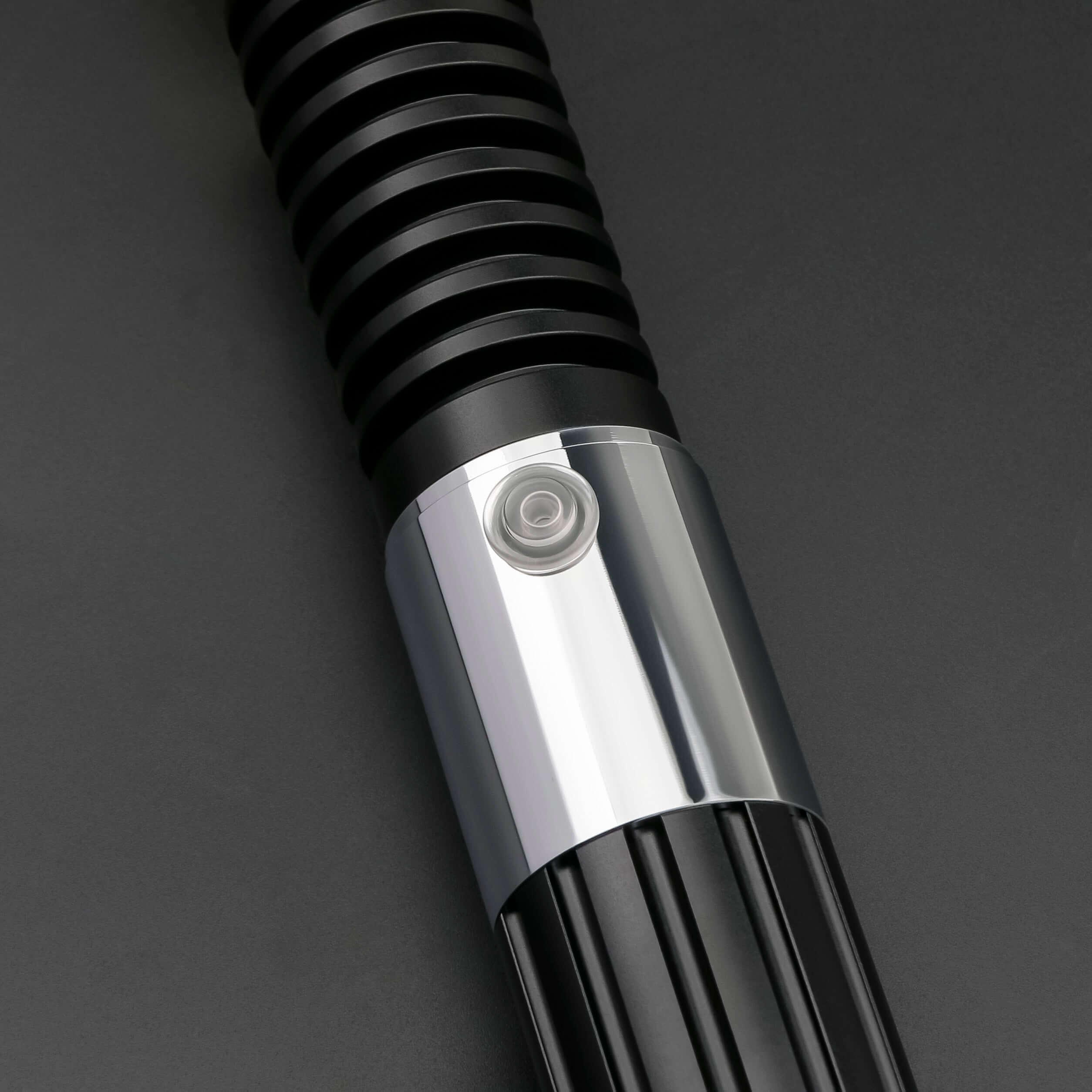 Close-up of the Obi-Wan Kenobi Neopixel Lightsaber hilt, showcasing its detailed design and button.