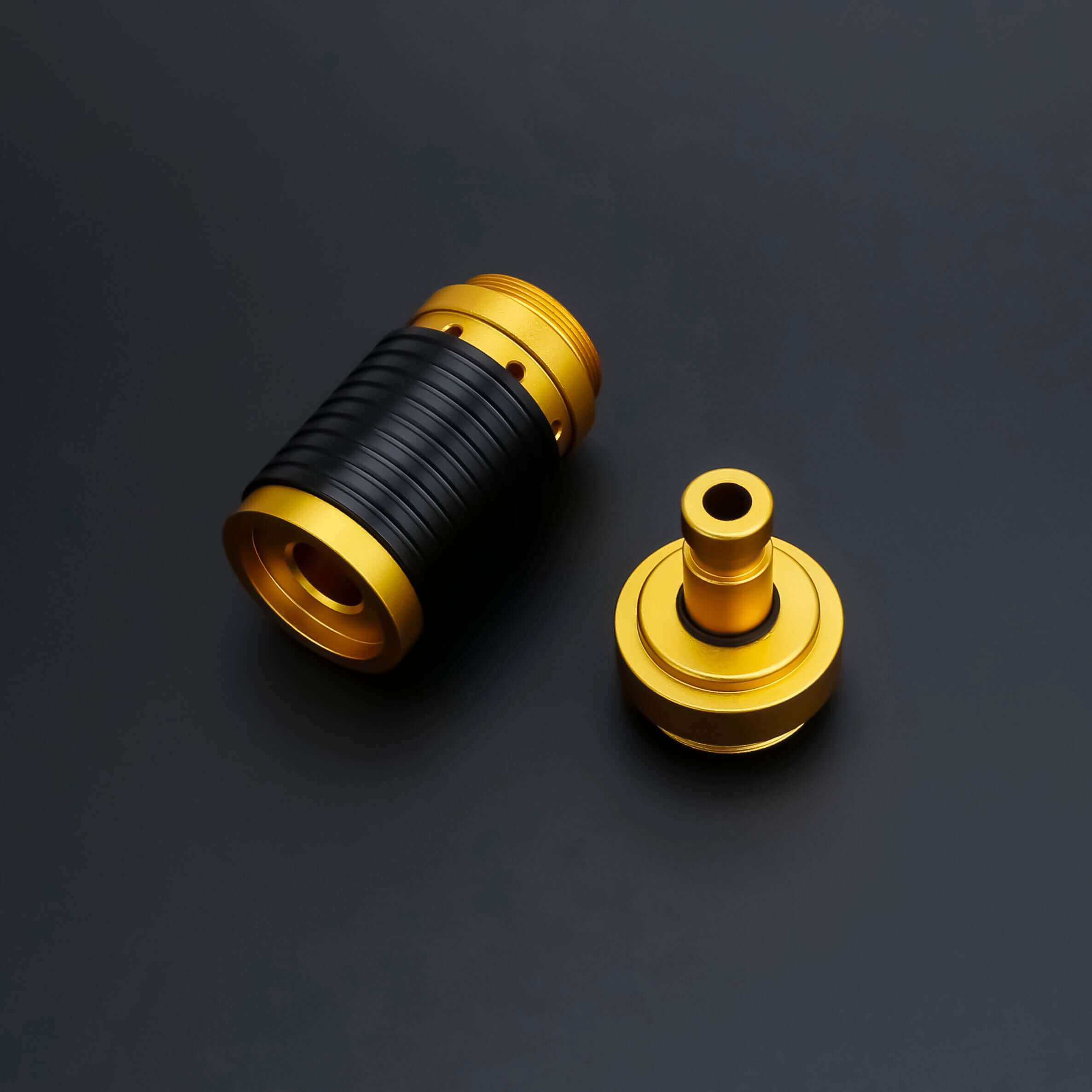 Universal quick release coupler showing gold and black components for lightsaber handles.