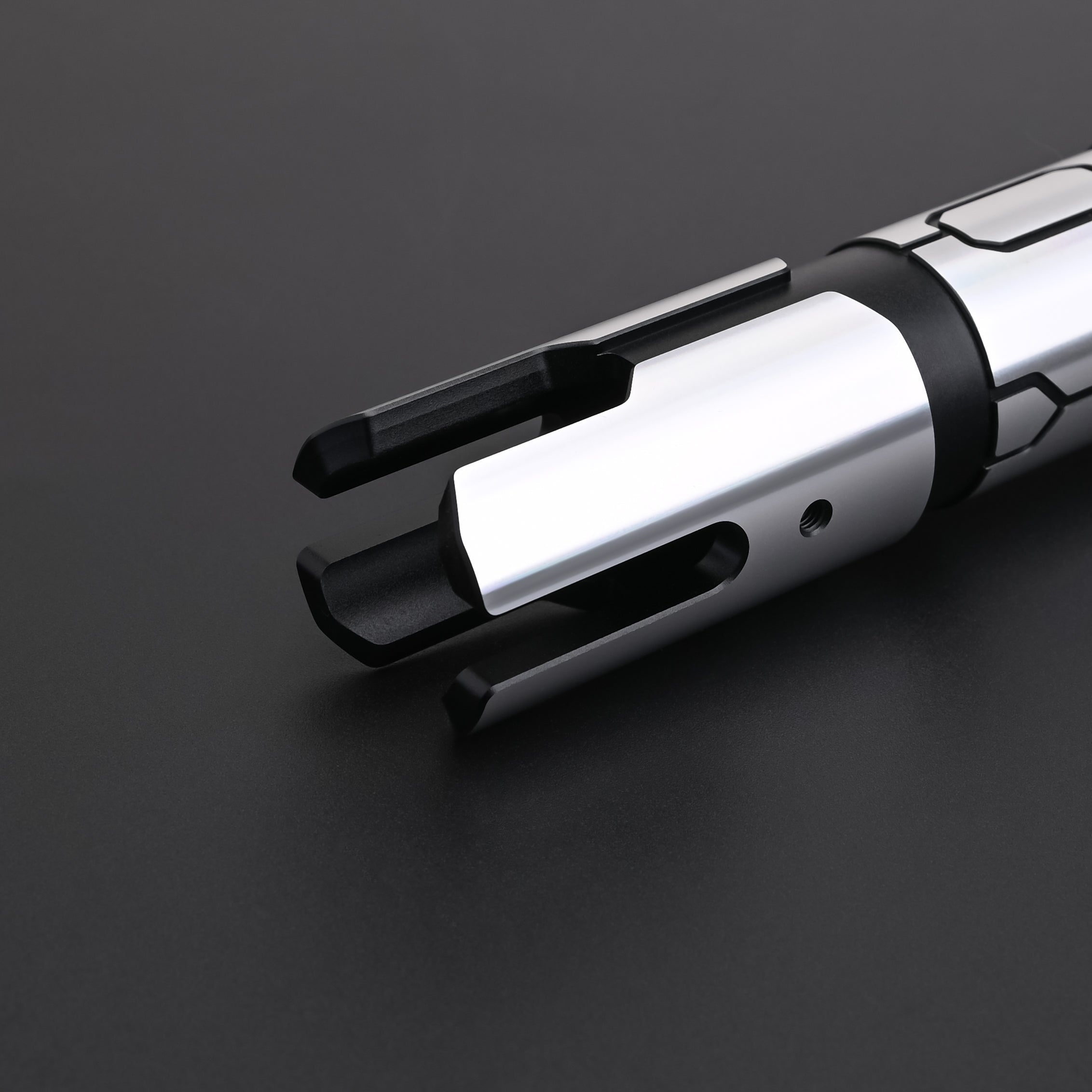Close-up of the Obsidian Elite Trinity lightsaber emitter and hilt design details