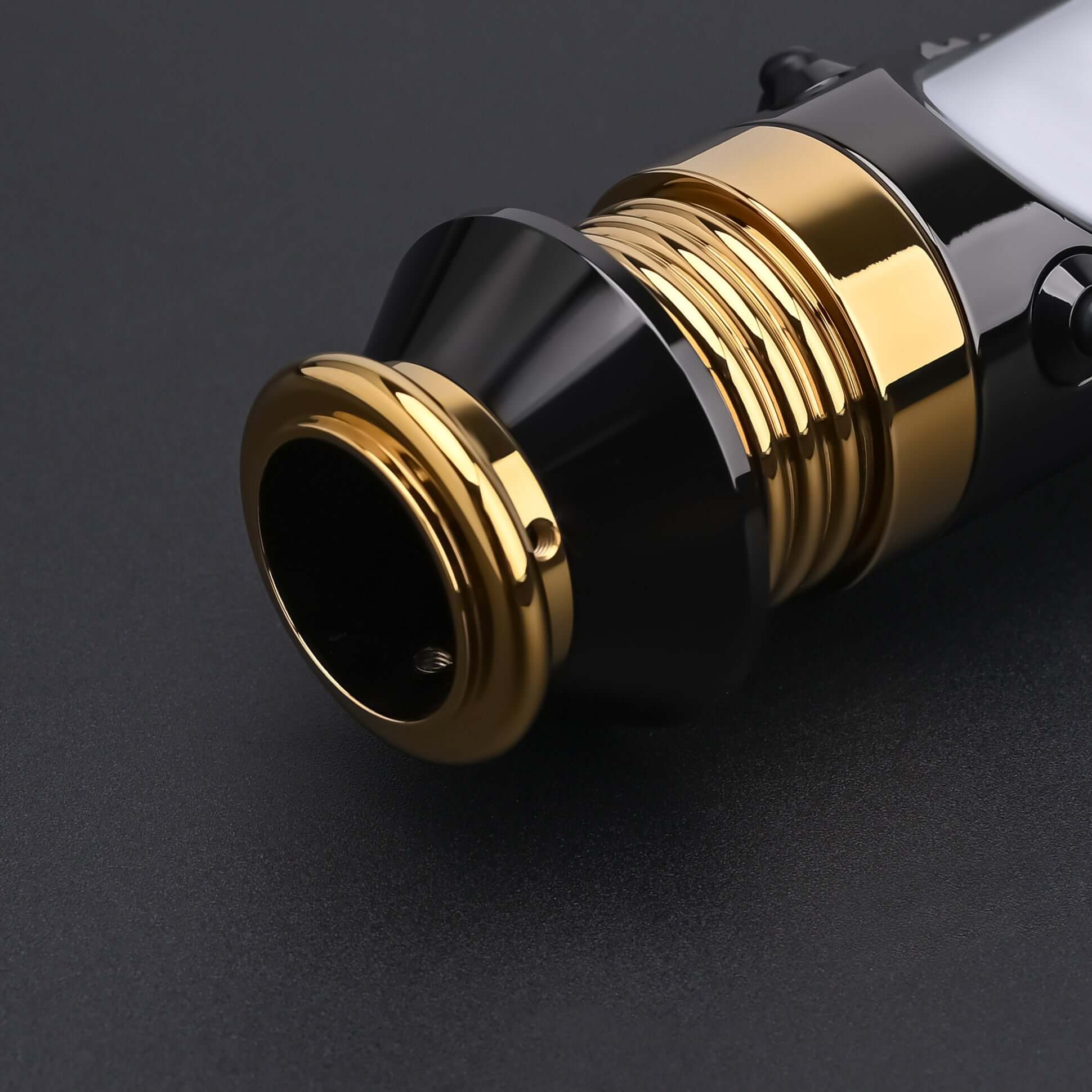 Close-up of the Emperor lightsaber emitter and gold-plated details