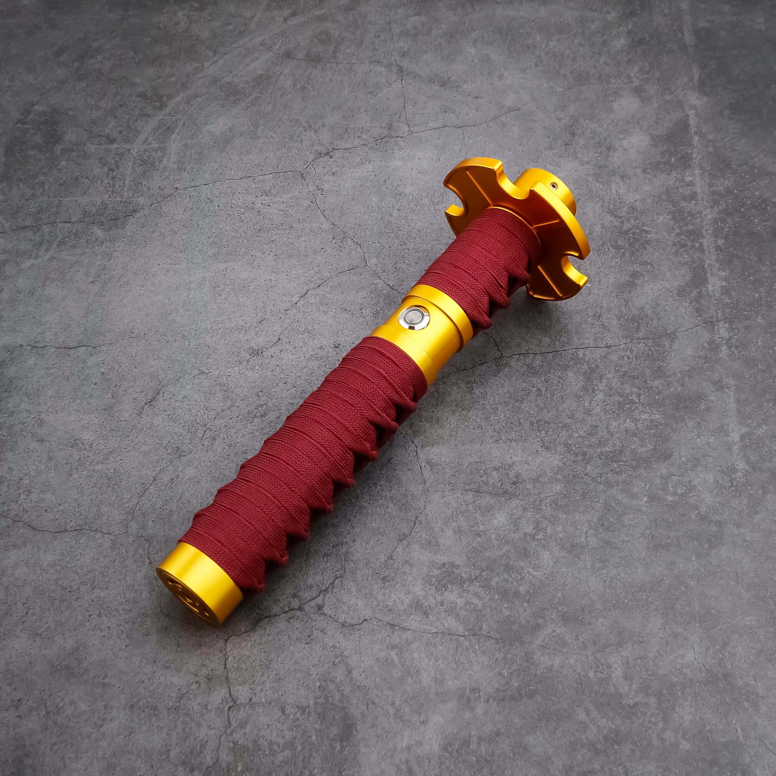 Sekiro Lightsaber: Katana-inspired design with gold hilt, red grip, and gold guard, crafted from aircraft-grade aluminum for durability and elegance.