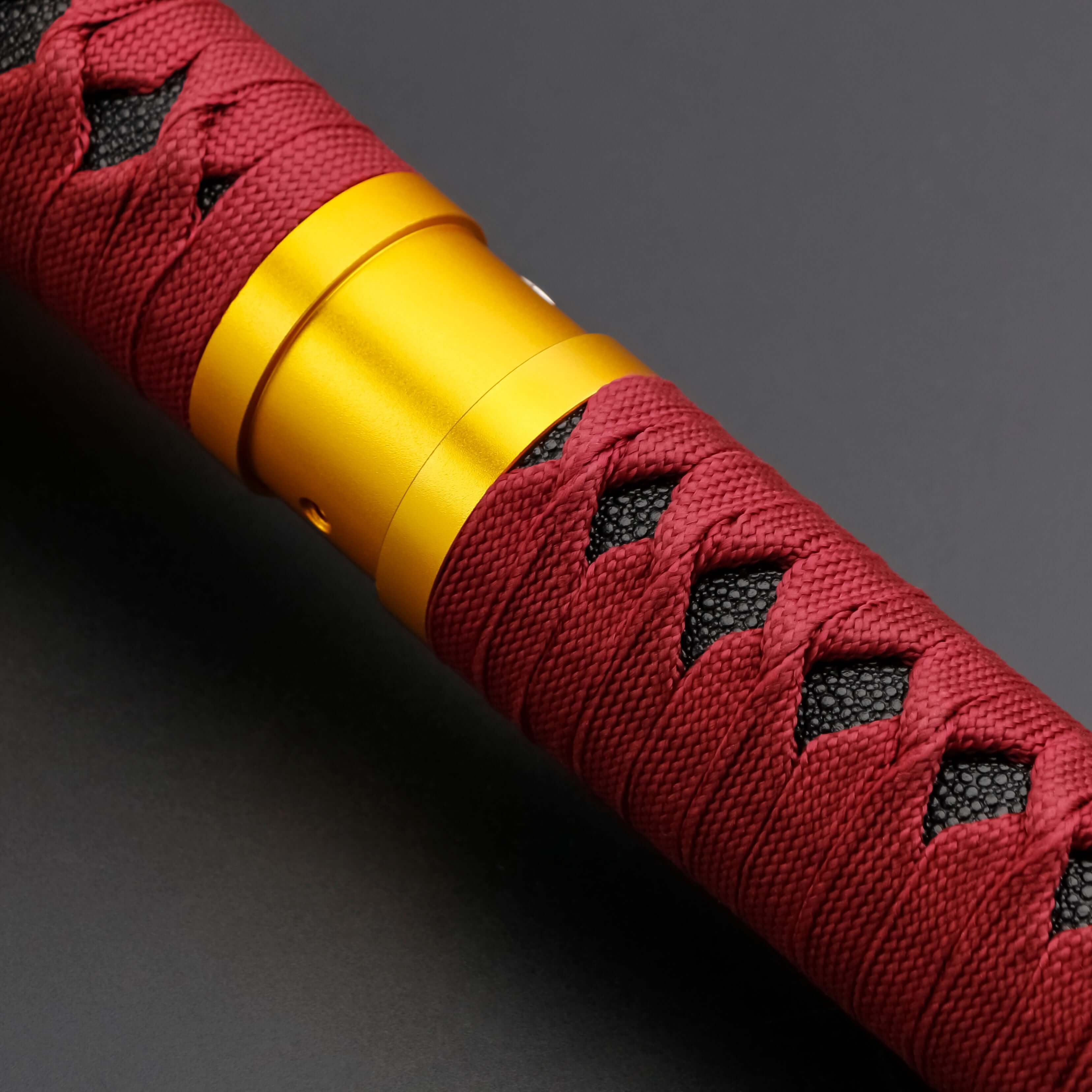 Sekiro Lightsaber: Katana-inspired design with gold hilt, red grip, and gold guard, crafted from aircraft-grade aluminum for durability and elegance.