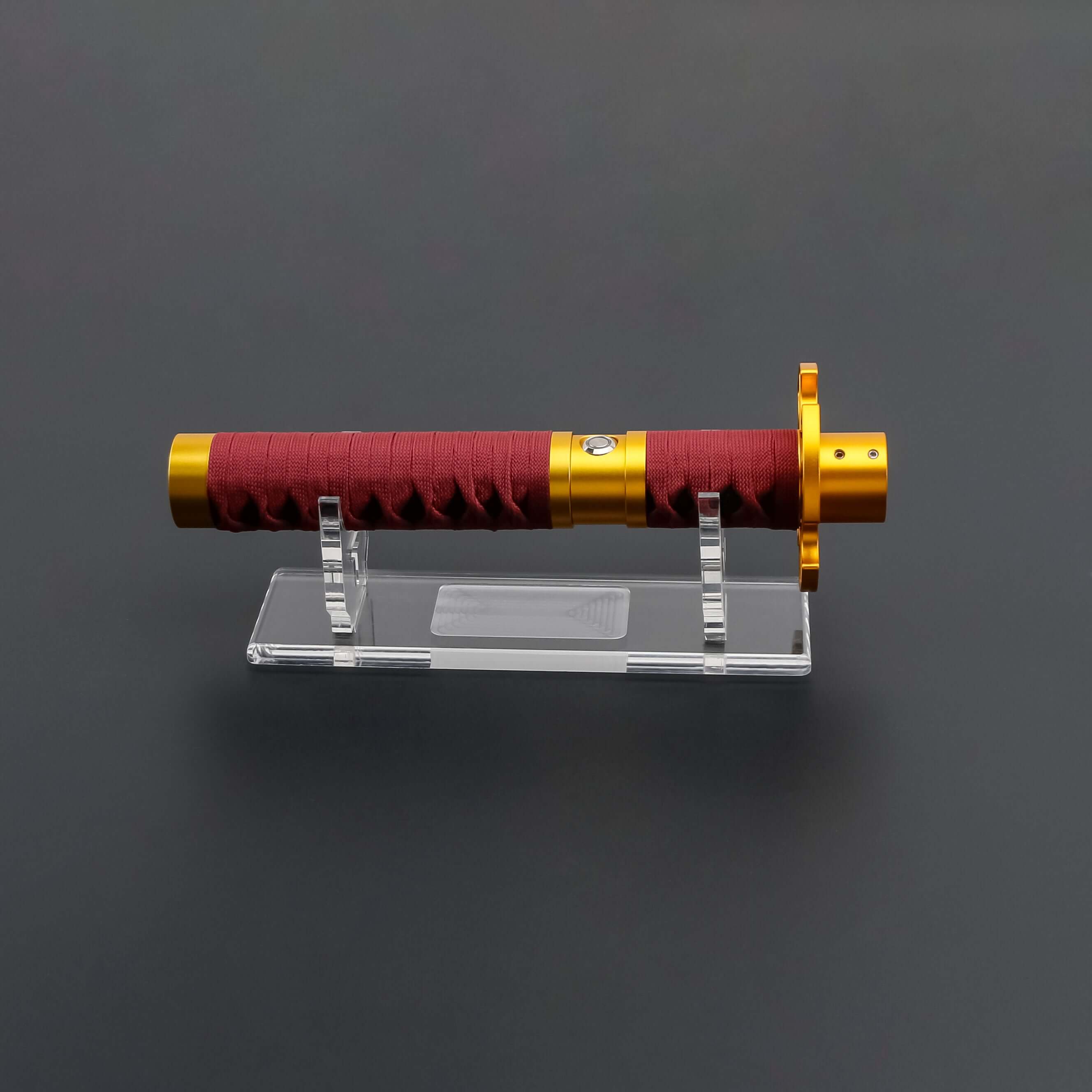 Sekiro Lightsaber: Katana-inspired design with gold hilt, red grip, and gold guard, crafted from aircraft-grade aluminum for durability and elegance.