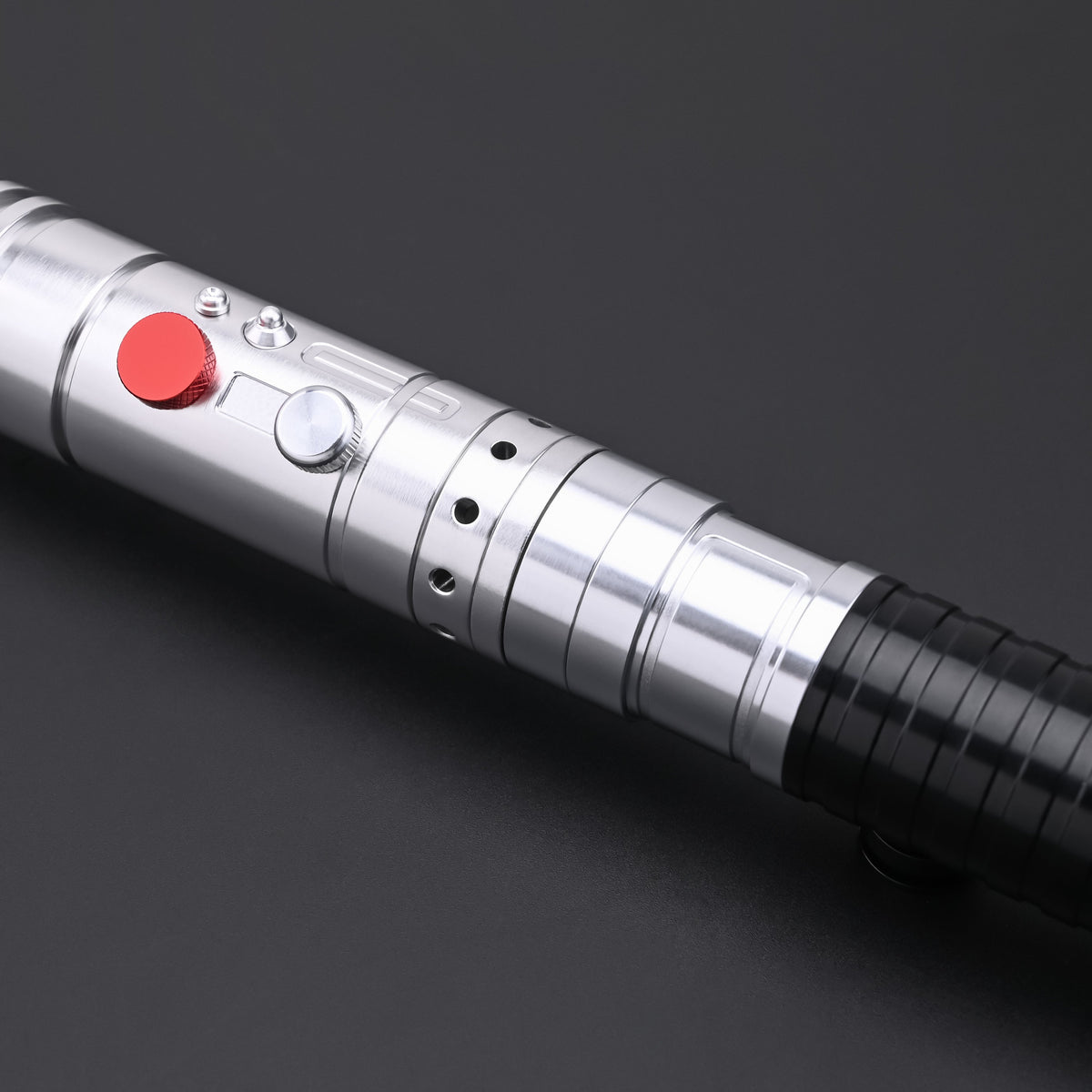 Detailed focus on the ergonomic control section of the Maul-Ventress lightsaber hilt