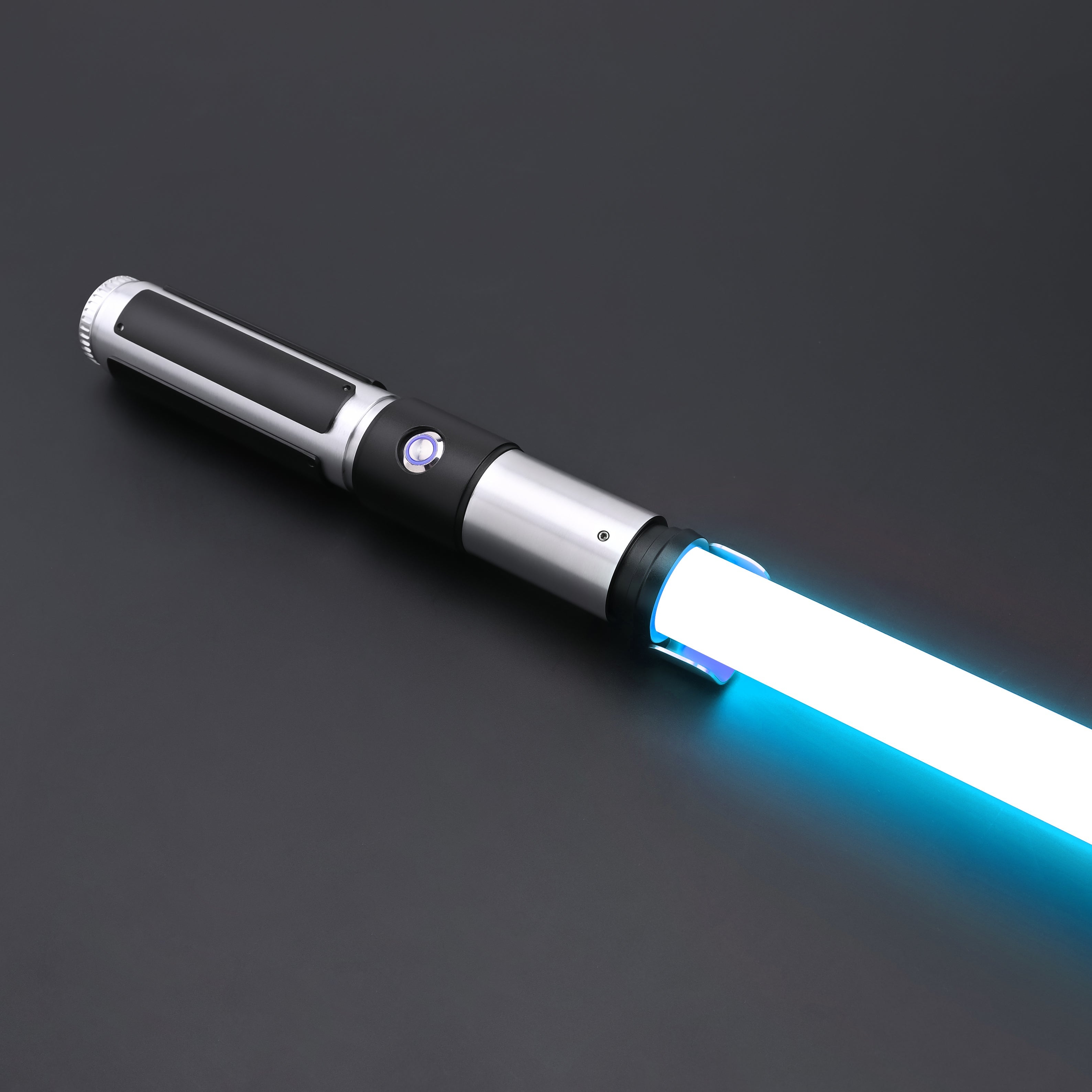 Yoda SE Lightsaber resting on a black background, featuring a sleek hilt and glowing blue blade.