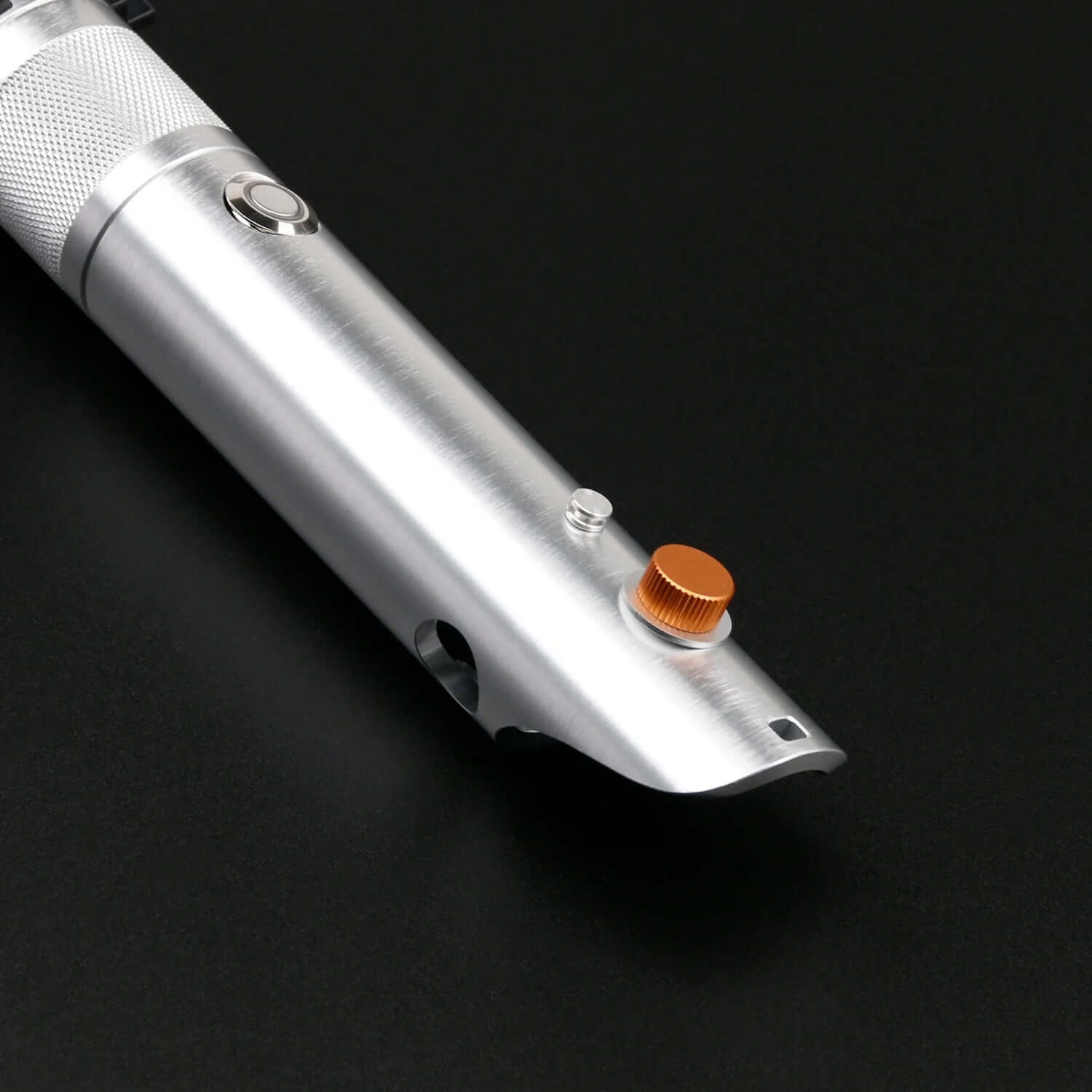 Close-up of the polished metal hilt of the Combat Saber-Anakin showing buttons and design details.