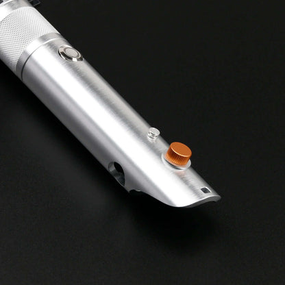 Close-up of the polished metal hilt of the Combat Saber-Anakin showing buttons and design details.