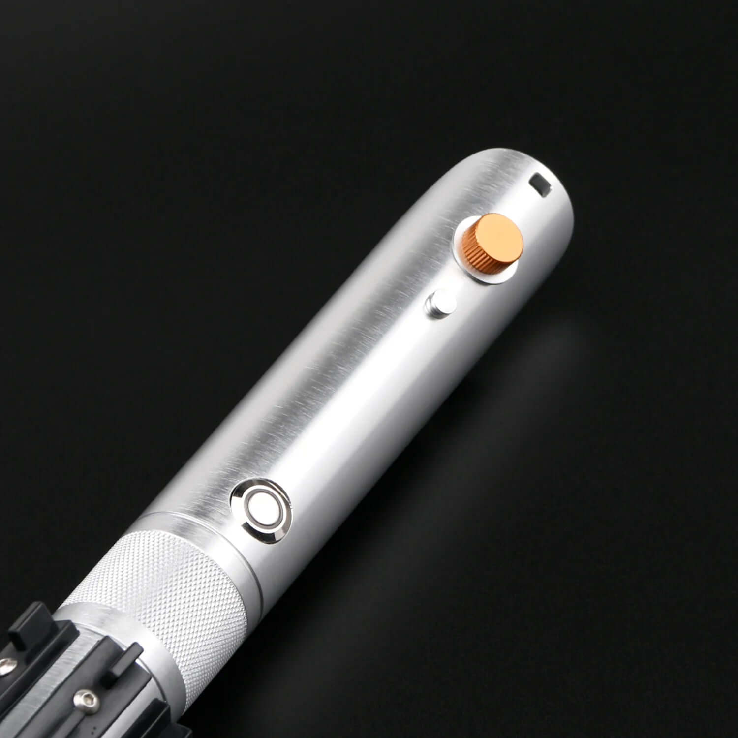 Close-up of the Combat Saber-Anakin hilt showcasing polished metal finish and distinct button details.