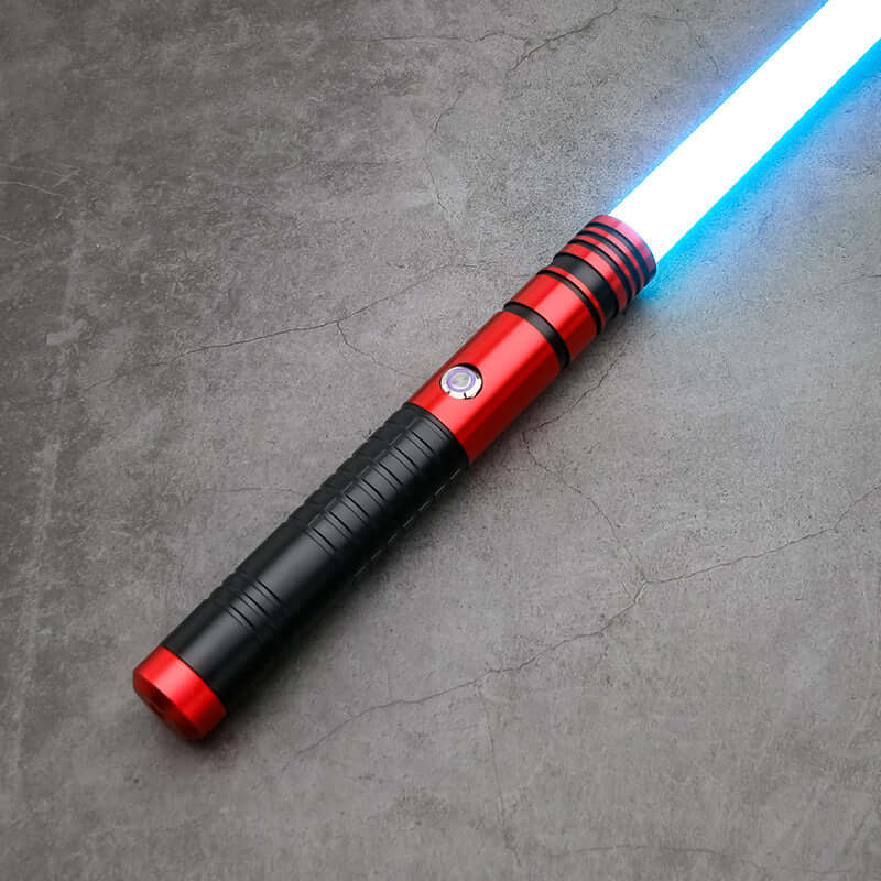 Jedi survivor twin lightsaber with red and black handle and blue blade, featuring ergonomic design for superior handling.