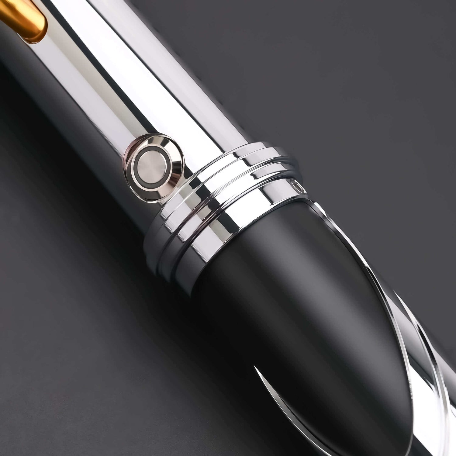 Count SE Lightsaber with black and silver hilt, spiraling silver trim, gold and red accents, and flared emitter. Crafted from aircraft-grade aluminum for balance, control, and precision.