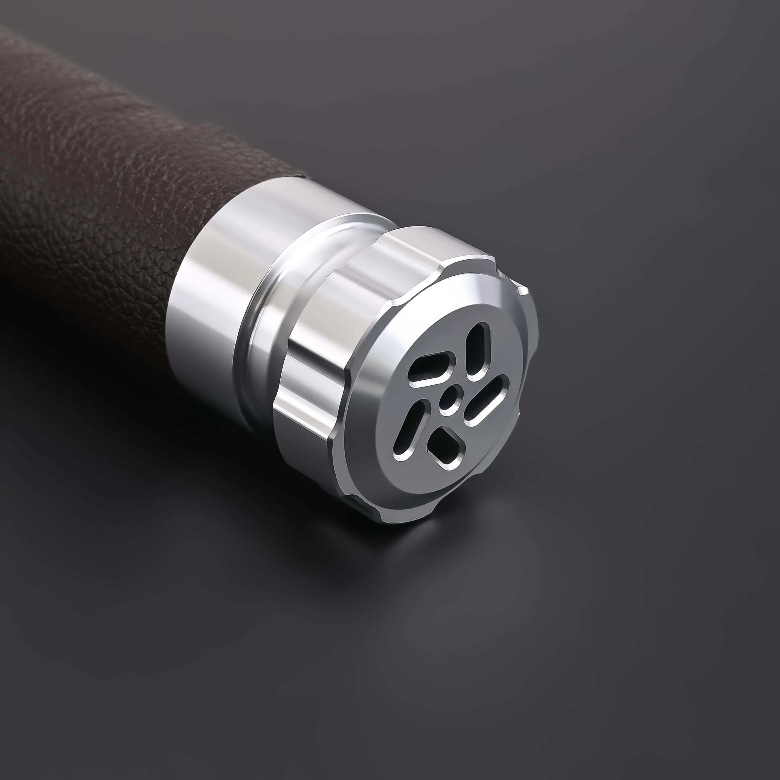 Close-up of the hilt of the Crusades Lightsaber featuring a sleek metallic design and textured grip.