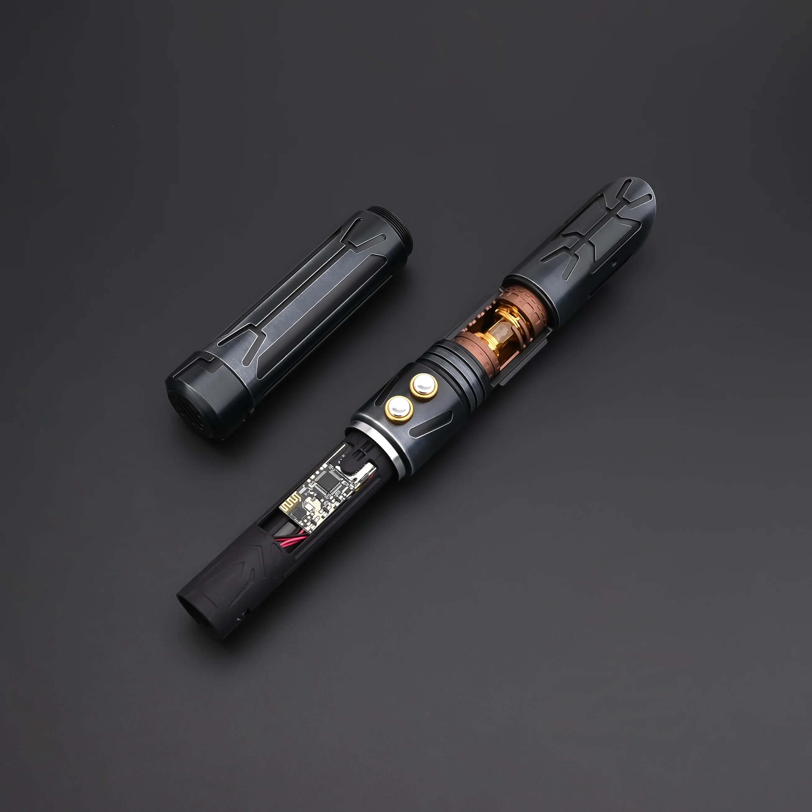 Close-up of the Halo Crystal lightsaber showing its exposed crystal core and dual-button control system.