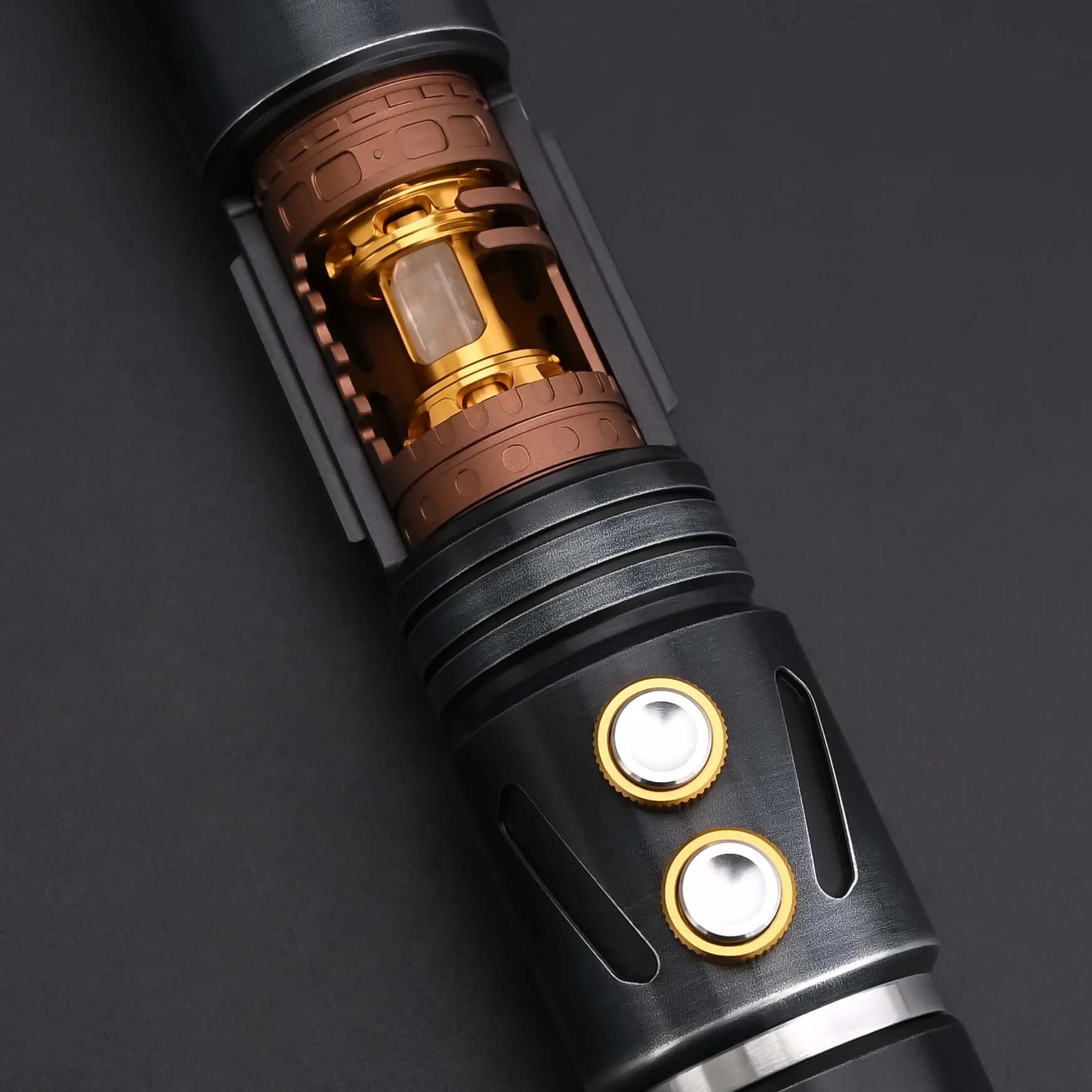 Close-up of the inner mechanism of the Halo Crystal lightsaber, featuring exposed crystal core and dual-button controls.