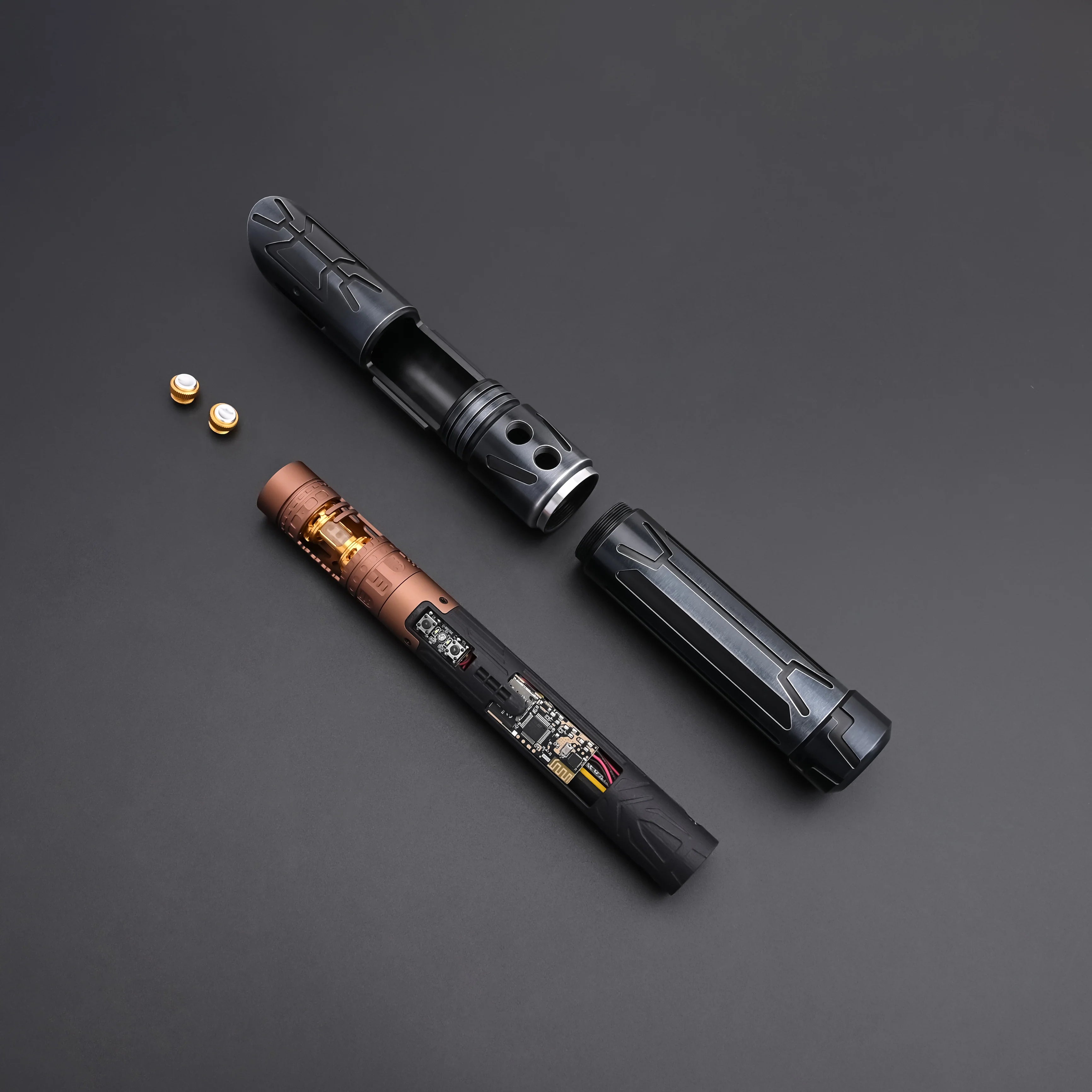 Halo crystal lightsaber parts with exposed crystal core and detailed design on a dark background.