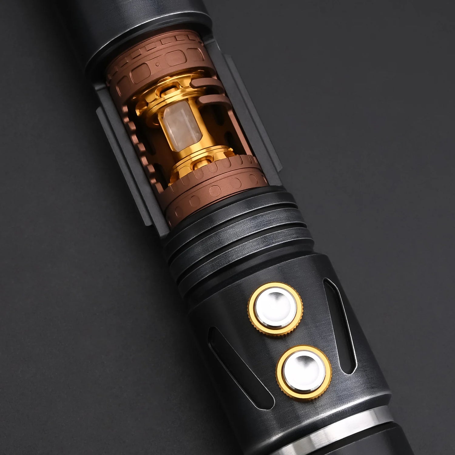 Close-up of the inner mechanism of the Halo Crystal lightsaber, featuring exposed crystal core and dual-button controls.