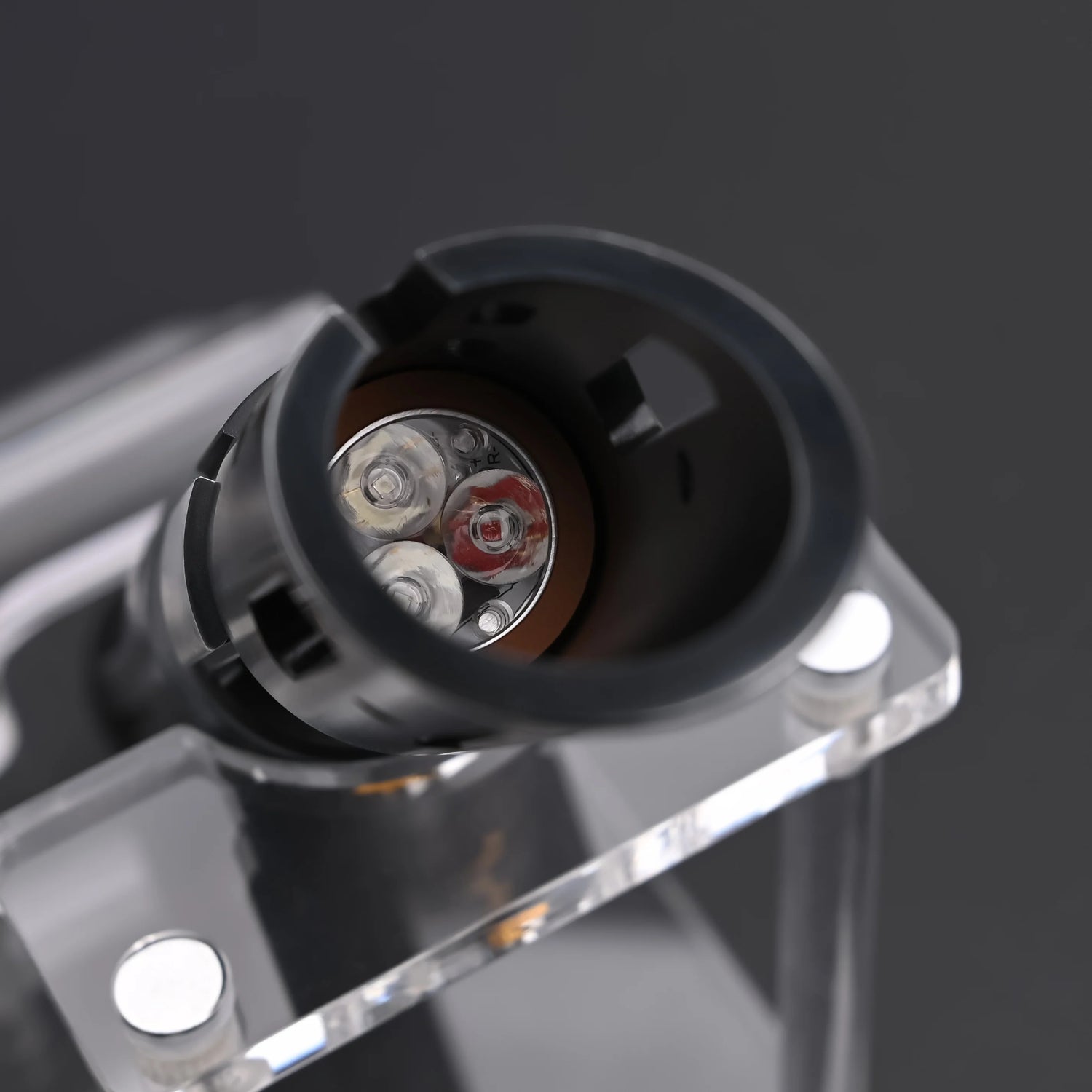 Close-up view of the Halo crystal lightsaber showing the exposed crystal core and refined control system.