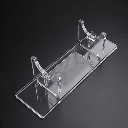 Clear Acrylic Saber Stand: Sleek, transparent design providing stability and visual appeal for showcasing collectible lightsabers.
