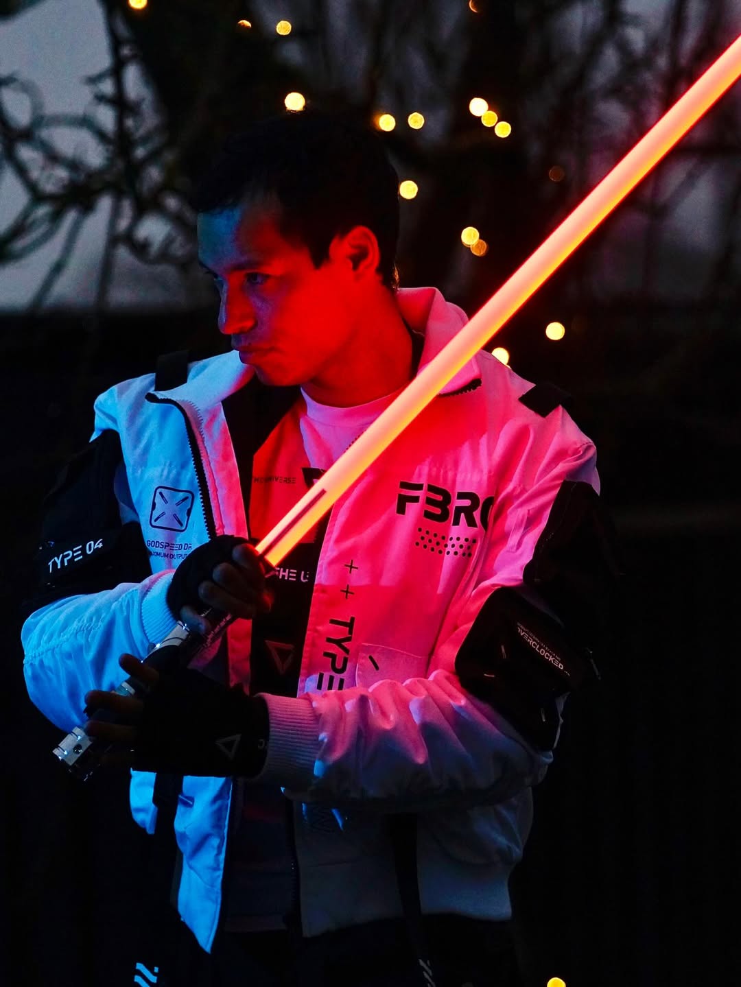 Count SE Lightsaber with black and silver hilt, spiraling silver trim, gold and red accents, and flared emitter. Crafted from aircraft-grade aluminum for balance, control, and precision.