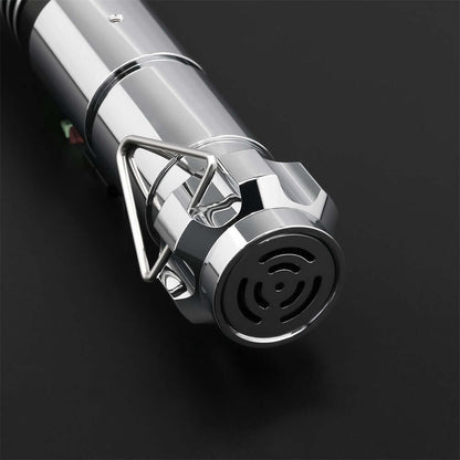 Close-up view of the grip and emitter of Luke EP6 lightsaber replica with circular patterns and shiny finish.