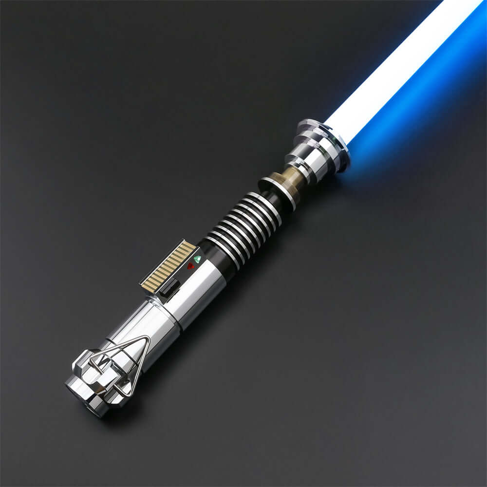 Luke EP6 lightsaber replica featuring a shiny chrome hilt and blue blade on a dark background.