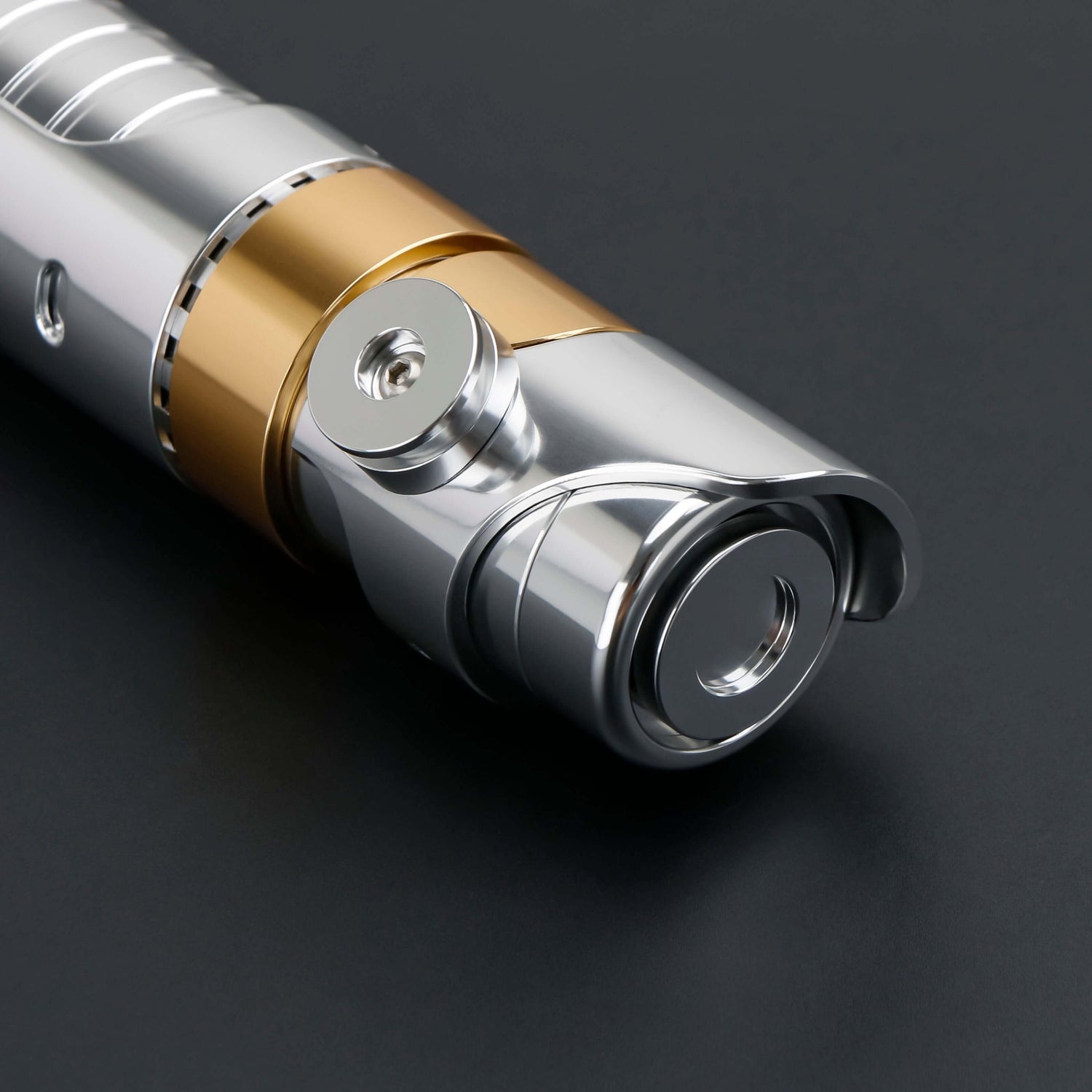Skeleton Crew SE lightsaber with silver and gold hilt, featuring Baselit, S-RGB, Neopixel, or Proffie core options, 12 blade colors, multiple blade effects, and a durable design suitable for display and light dueling.
