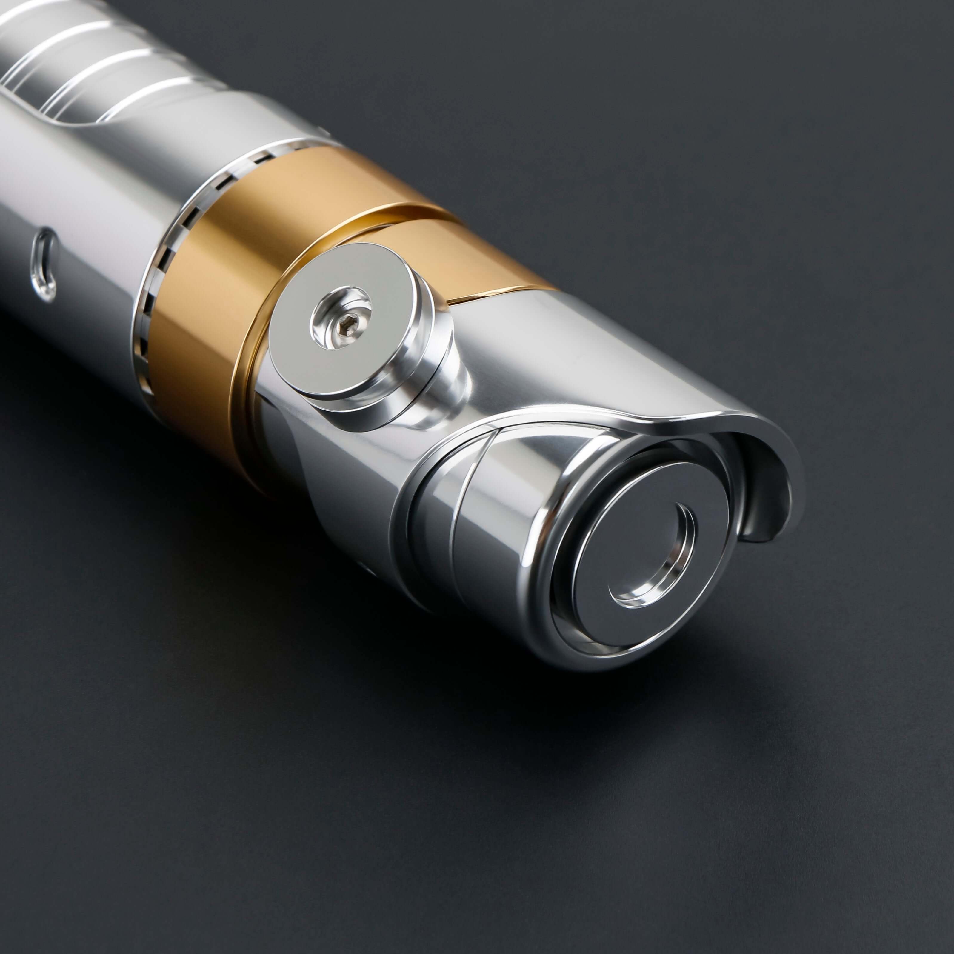 Skeleton Crew SE lightsaber with silver and gold hilt, featuring Baselit, S-RGB, Neopixel, or Proffie core options, 12 blade colors, multiple blade effects, and a durable design suitable for display and light dueling.