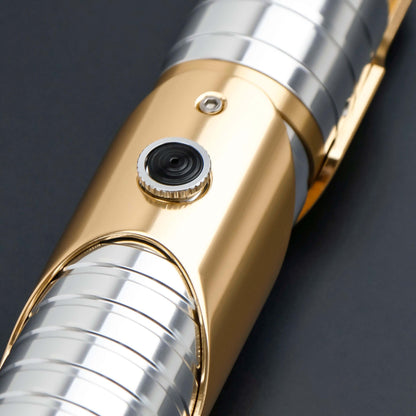 Skeleton Crew SE lightsaber with silver and gold hilt, featuring Baselit, S-RGB, Neopixel, or Proffie core options, 12 blade colors, multiple blade effects, and a durable design suitable for display and light dueling.