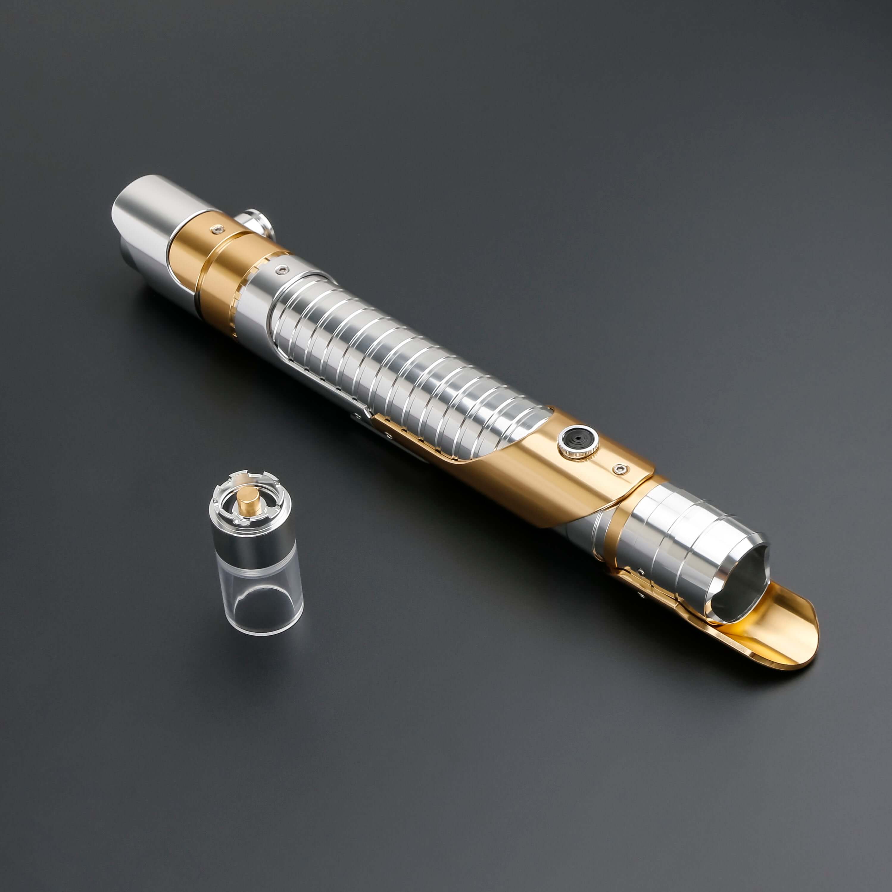 Skeleton Crew SE lightsaber with silver and gold hilt, featuring Baselit, S-RGB, Neopixel, or Proffie core options, 12 blade colors, multiple blade effects, and a durable design suitable for display and light dueling.