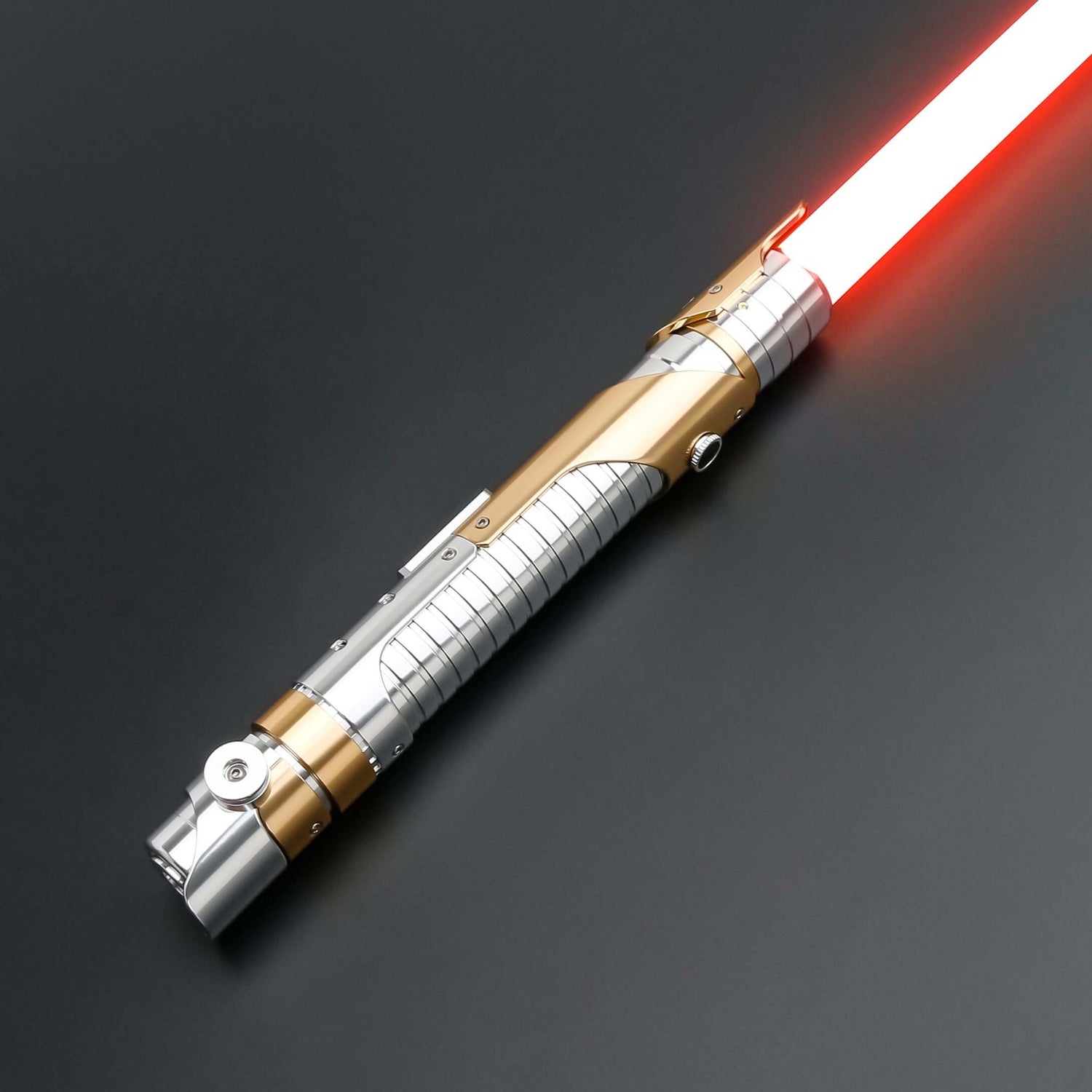 Skeleton Crew SE lightsaber with silver and gold hilt, featuring Baselit, S-RGB, Neopixel, or Proffie core options, 12 blade colors, multiple blade effects, and a durable design suitable for display and light dueling.