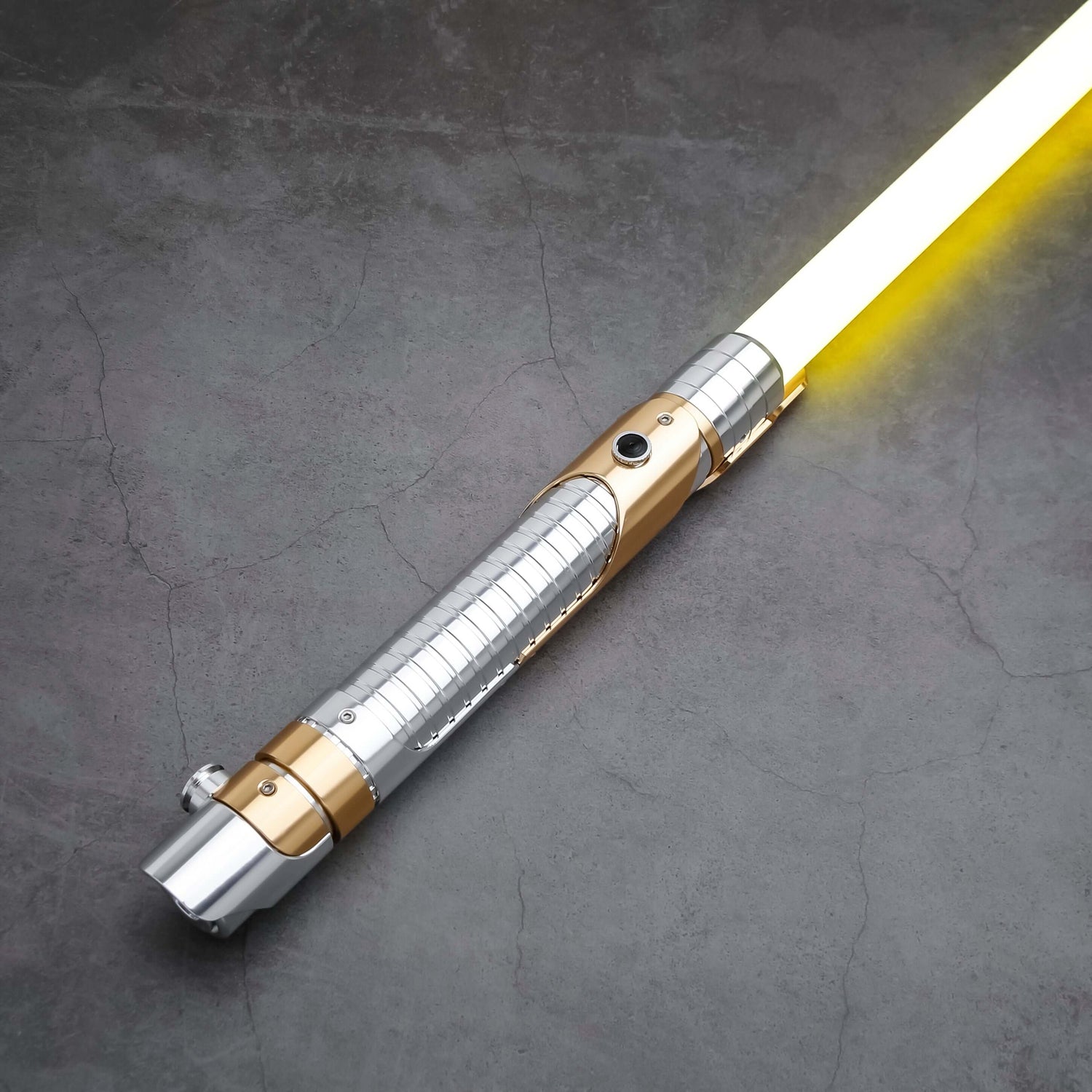 Skeleton Crew SE lightsaber with silver and gold hilt, featuring Baselit, S-RGB, Neopixel, or Proffie core options, 12 blade colors, multiple blade effects, and a durable design suitable for display and light dueling.