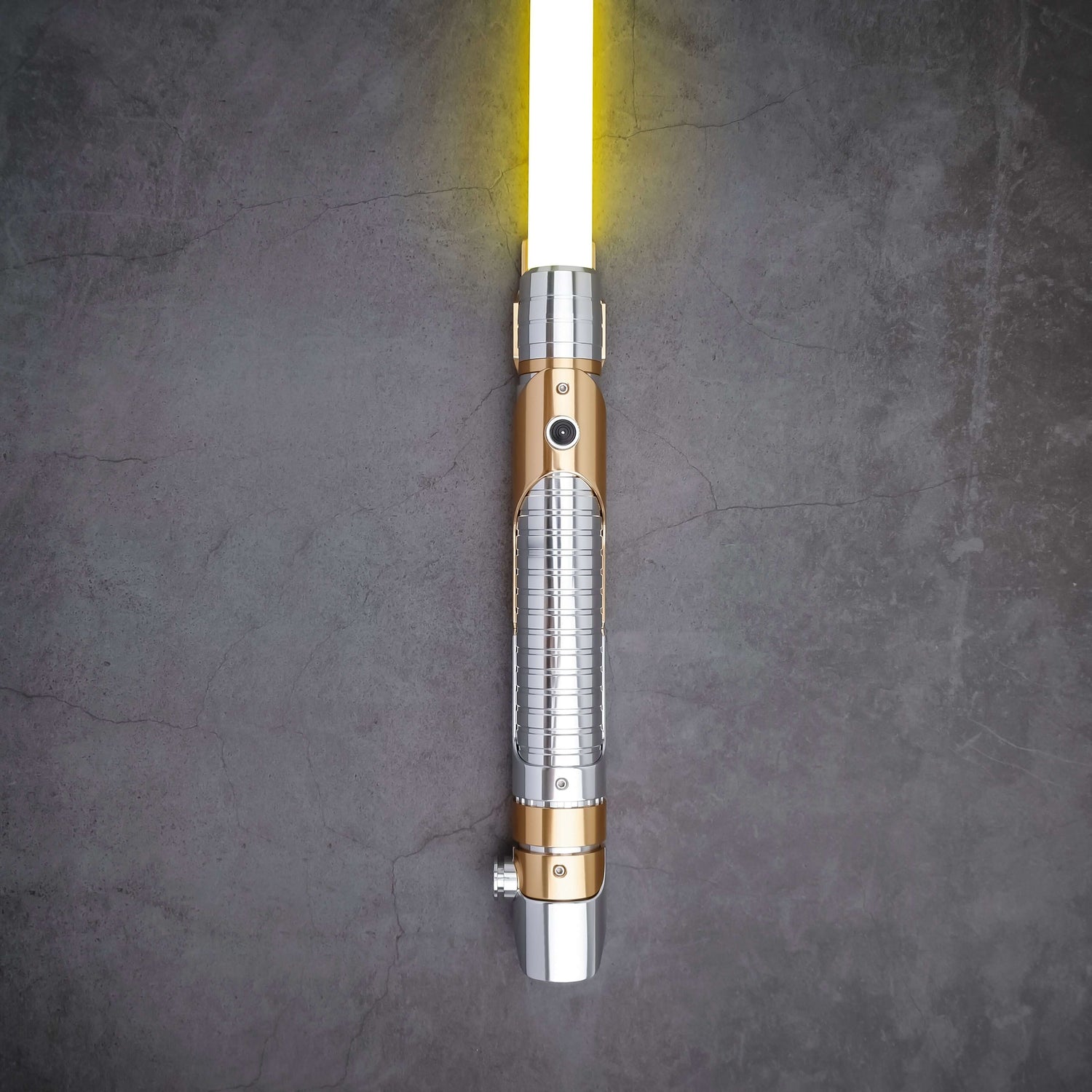 Skeleton Crew SE lightsaber with silver and gold hilt, featuring Baselit, S-RGB, Neopixel, or Proffie core options, 12 blade colors, multiple blade effects, and a durable design suitable for display and light dueling.
