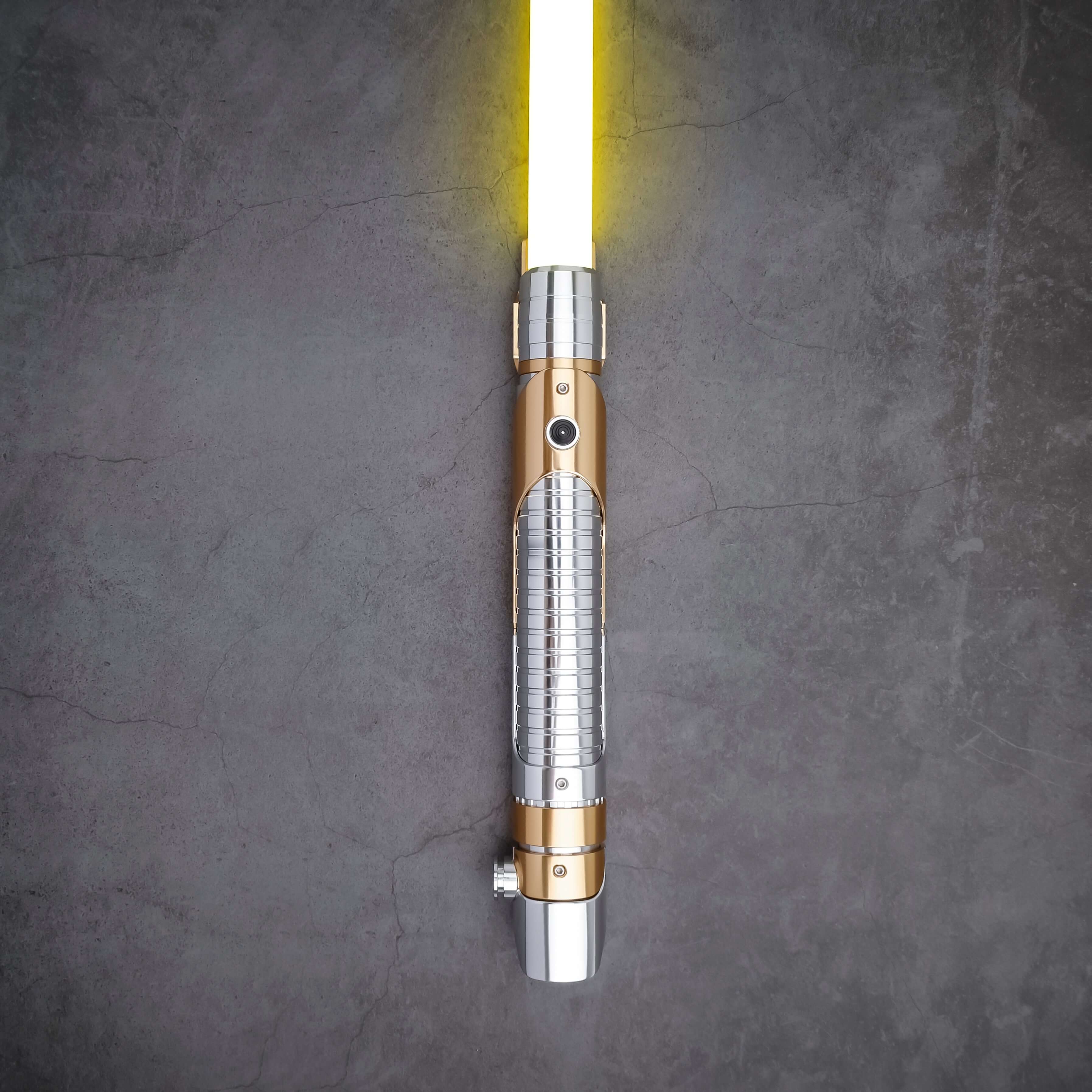 Skeleton Crew SE lightsaber with silver and gold hilt, featuring Baselit, S-RGB, Neopixel, or Proffie core options, 12 blade colors, multiple blade effects, and a durable design suitable for display and light dueling.