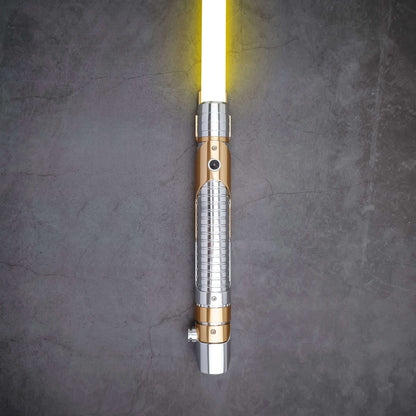 Skeleton Crew SE lightsaber with silver and gold hilt, featuring Baselit, S-RGB, Neopixel, or Proffie core options, 12 blade colors, multiple blade effects, and a durable design suitable for display and light dueling.