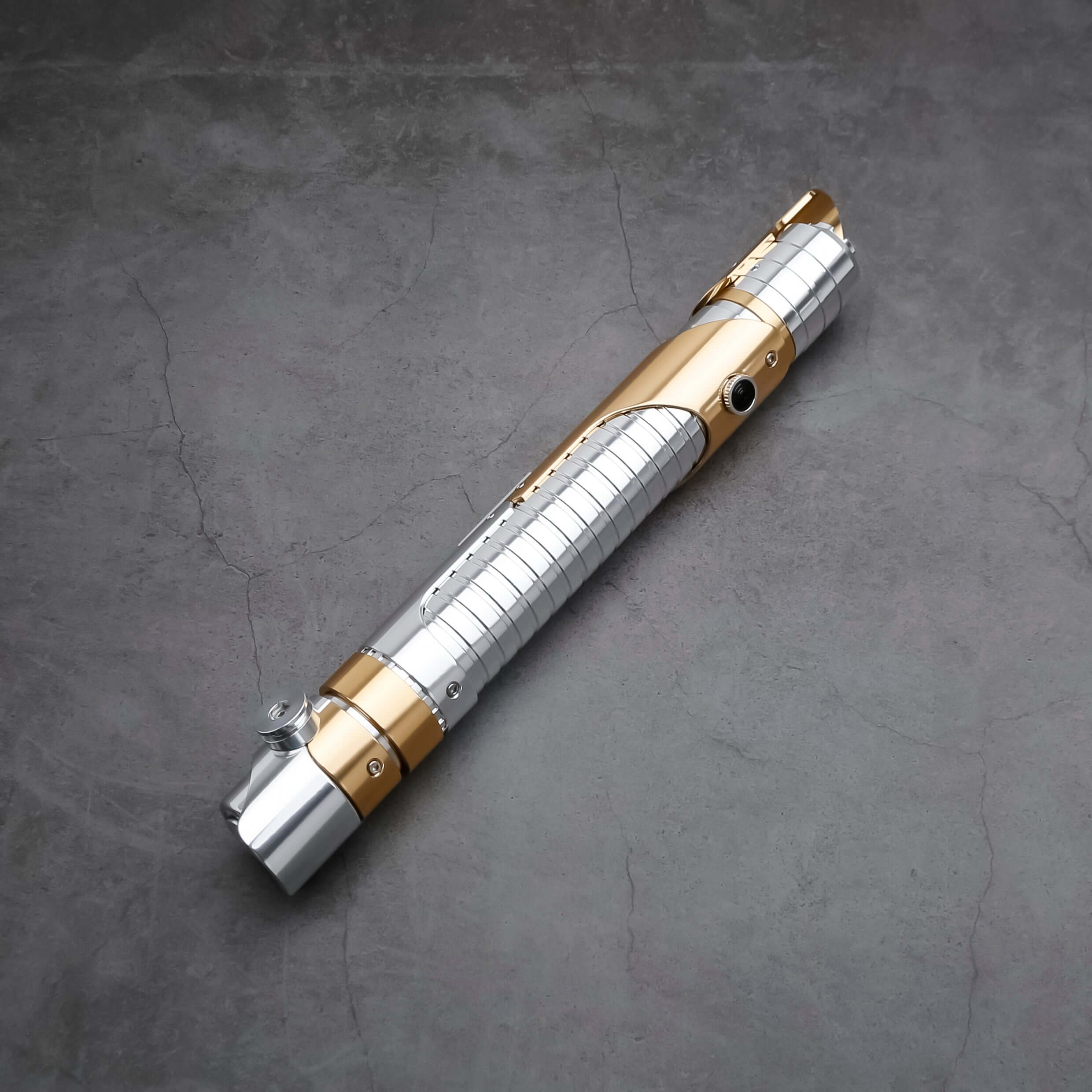 Skeleton Crew SE lightsaber with silver and gold hilt, featuring Baselit, S-RGB, Neopixel, or Proffie core options, 12 blade colors, multiple blade effects, and a durable design suitable for display and light dueling.