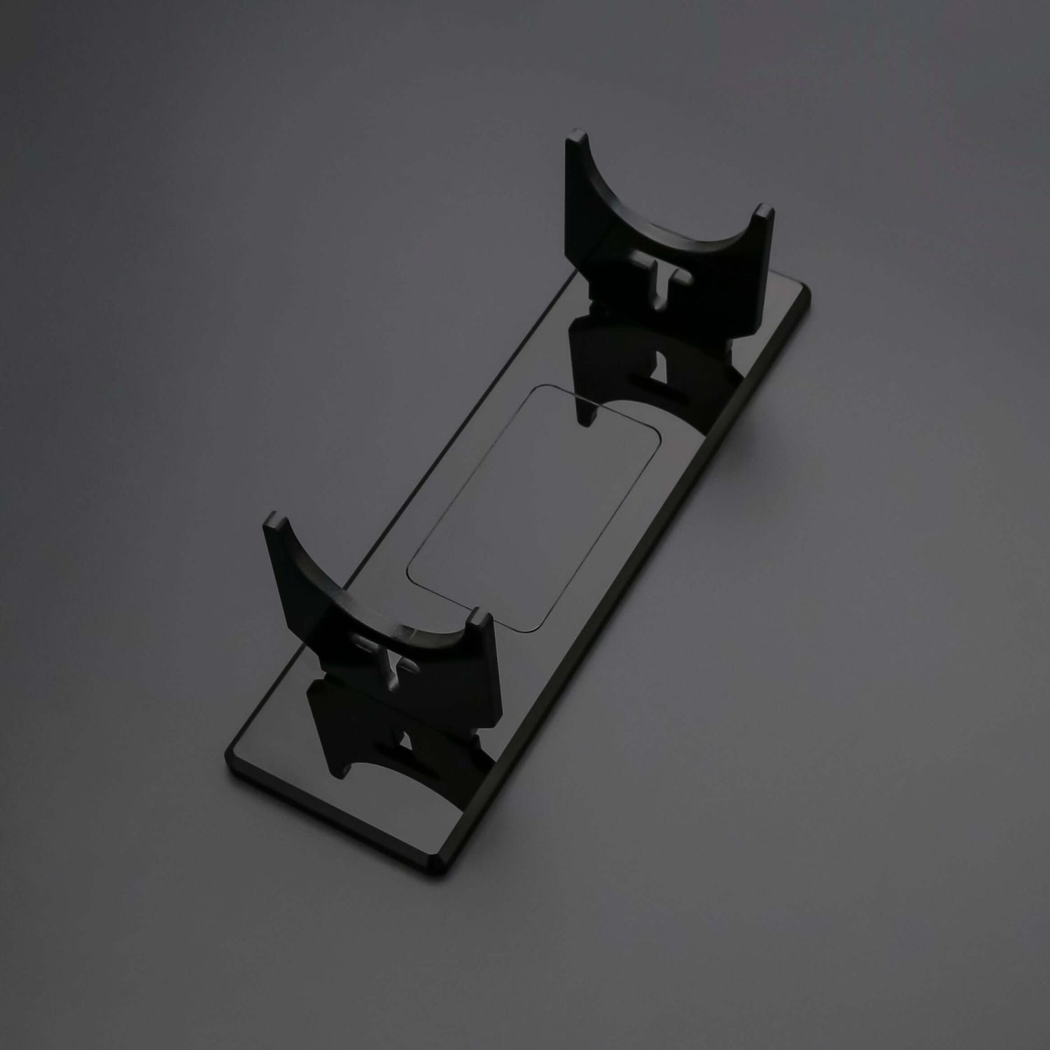 Clear acrylic display stand designed for stability, perfect for showcasing collectible sabers.