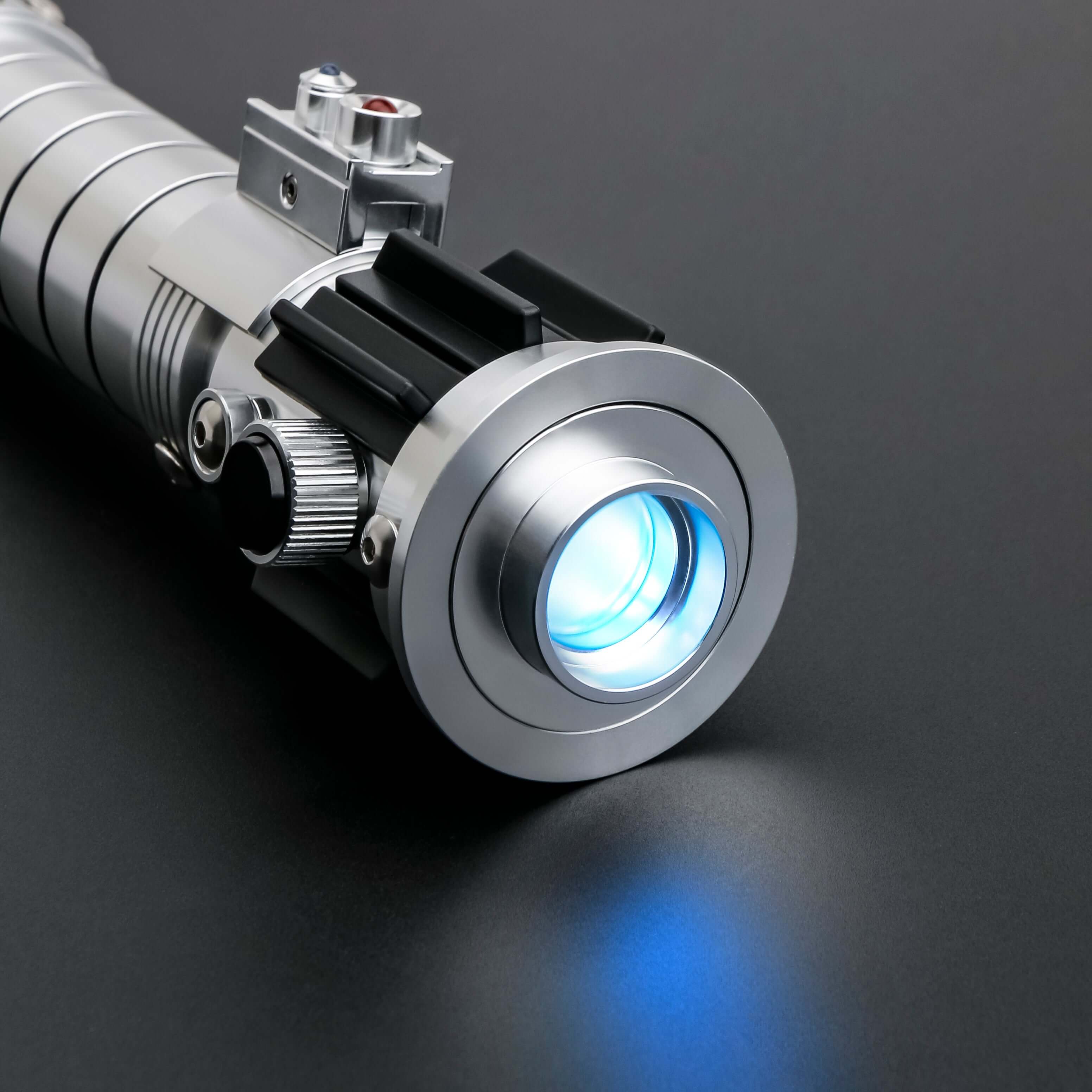 Mara Jade Lightsaber from Novasaber, featuring a sleek, crimson blade and a detailed, silver hilt with elegant design accents, inspired by the iconic Star Wars character.