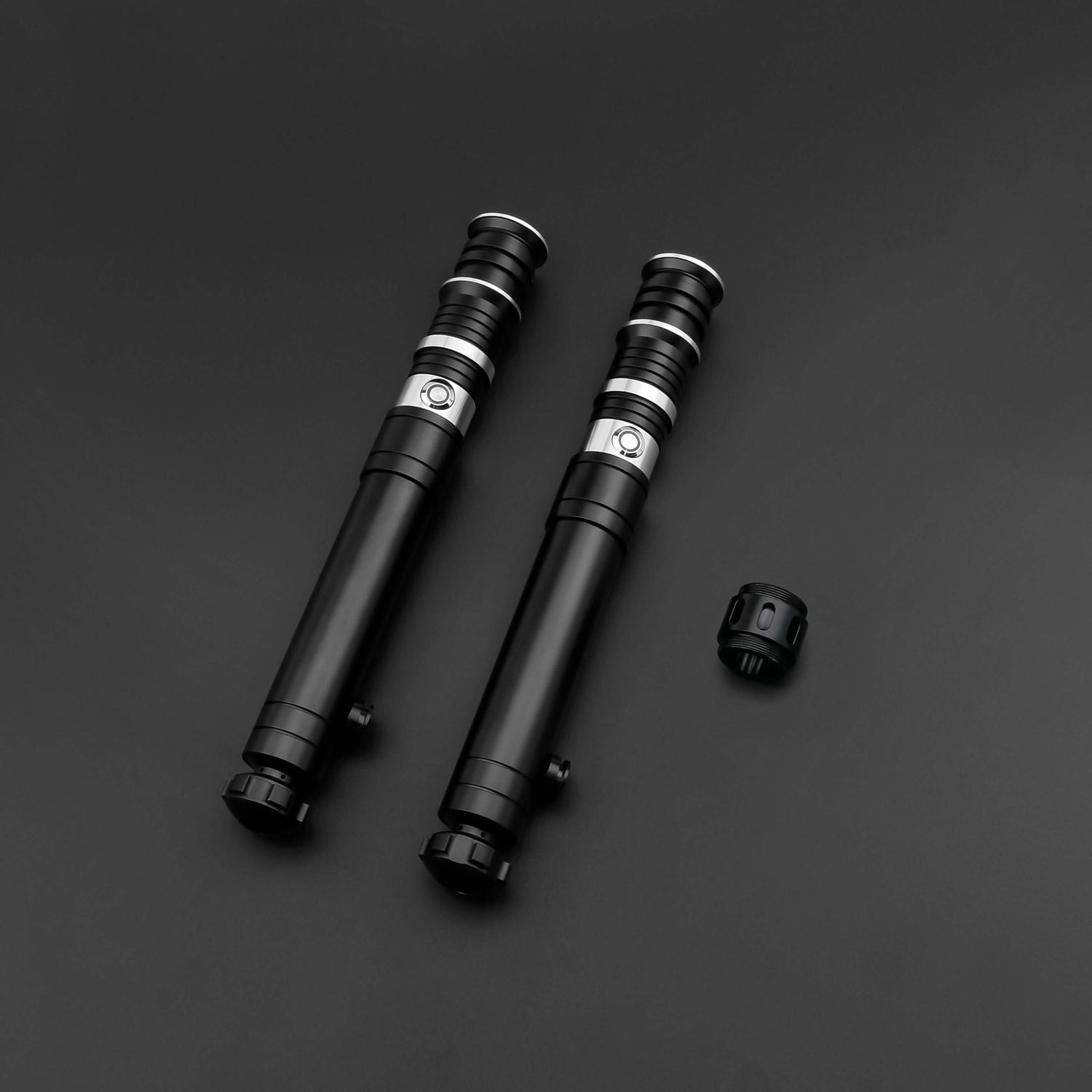 Huracan Double Bladed Saber featuring a compact design, belt clip for easy carrying, complimentary hilt connector, available in black and silver colors, with blade lengths of 82cm and 92cm, and various electronics options including RGB S16, RGB S27, SN Ne