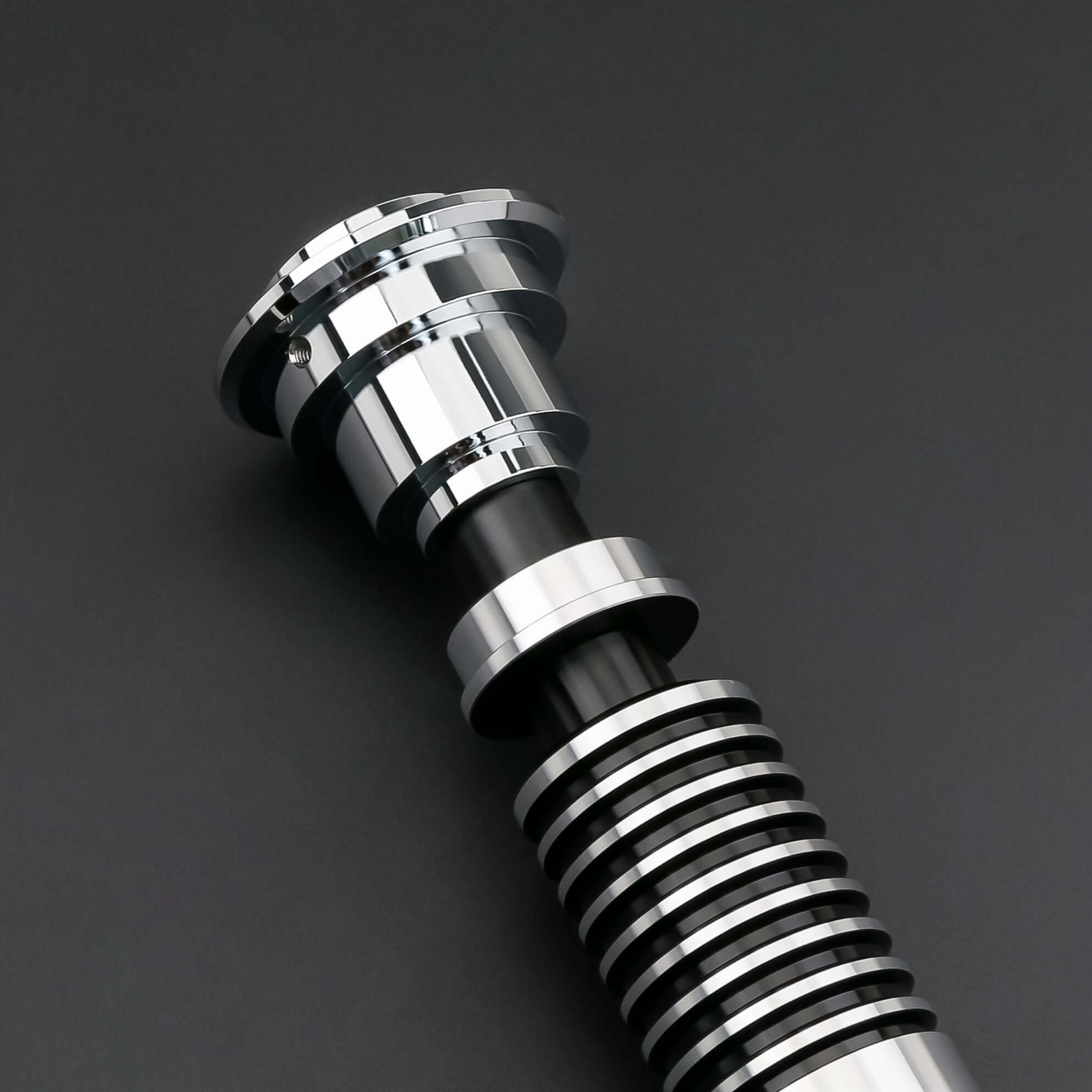 Luke SE Lightsaber from Novasaber, featuring a polished silver hilt with detailed gold accents and a vibrant green blade, inspired by the iconic weapon of Luke Skywalker from Star Wars