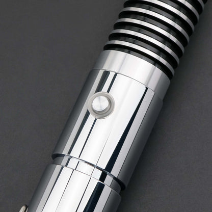 Luke SE Lightsaber from Novasaber, featuring a polished silver hilt with detailed gold accents and a vibrant green blade, inspired by the iconic weapon of Luke Skywalker from Star Wars